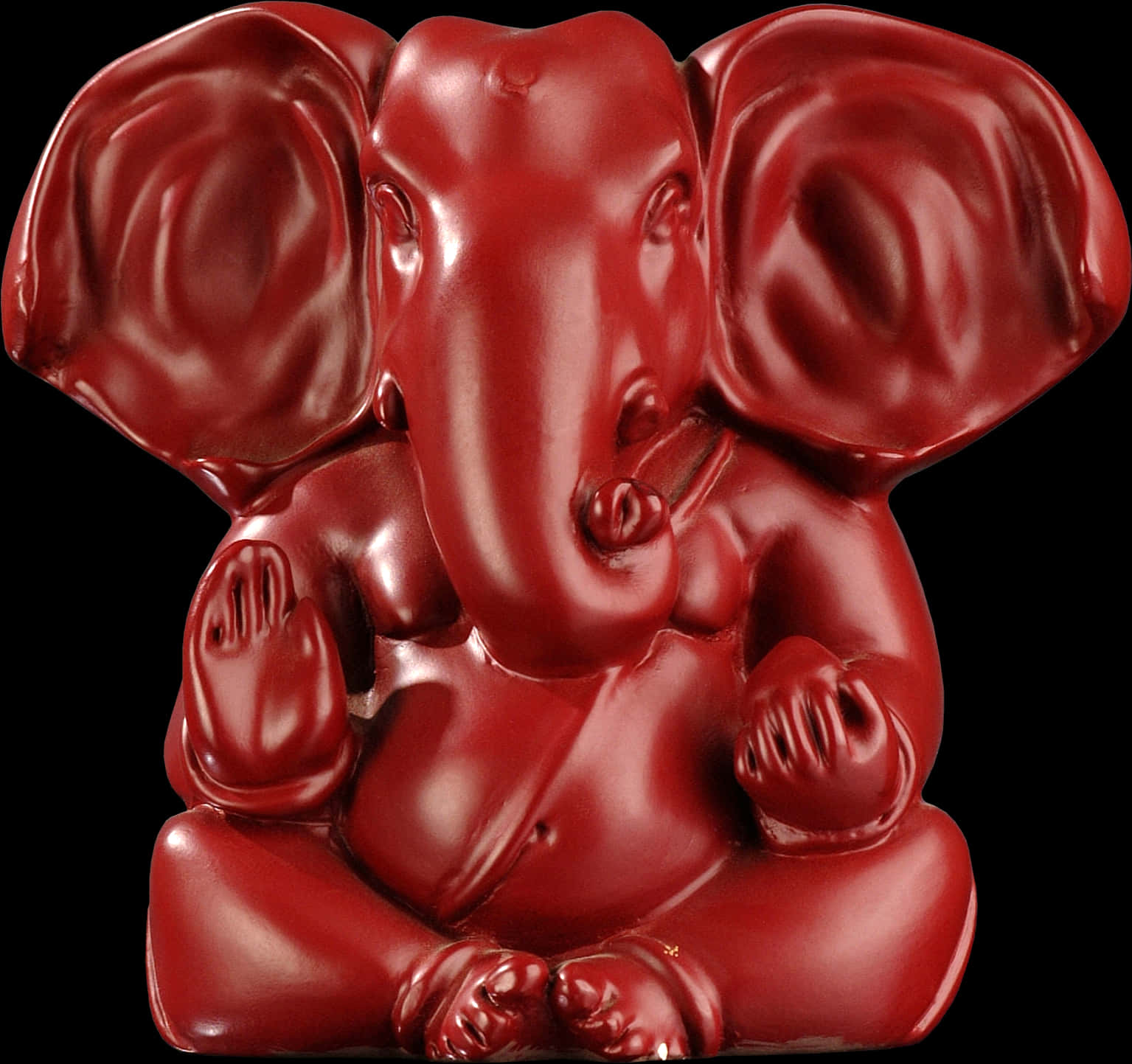 Ganpati 桌布 壁紙 — 一尊光滑深紅色的象頭神像寧靜地坐在純黑背景前。