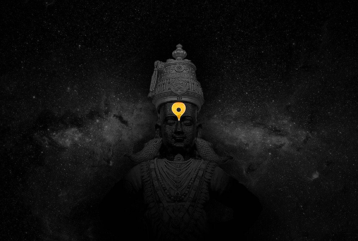 神祇雕像，額頭上有發光別針，背景是繁星宇宙 — 佛陀 GIF 壁紙