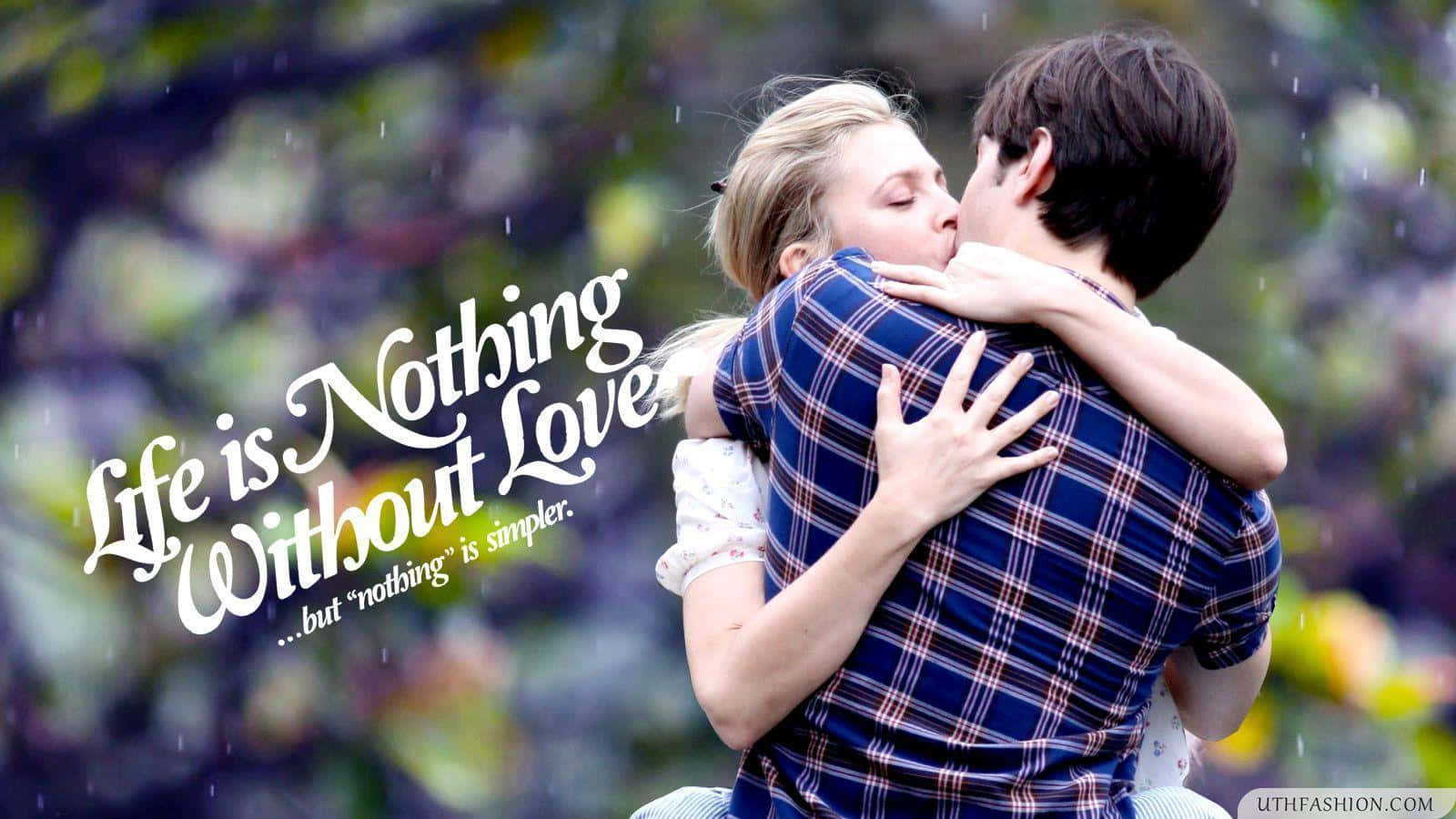 愛心 桌布 壁紙 — 一對情侶在雨中溫柔擁抱，文字 'Life is Nothing Without Love' 映襯在模糊的花園背景上。