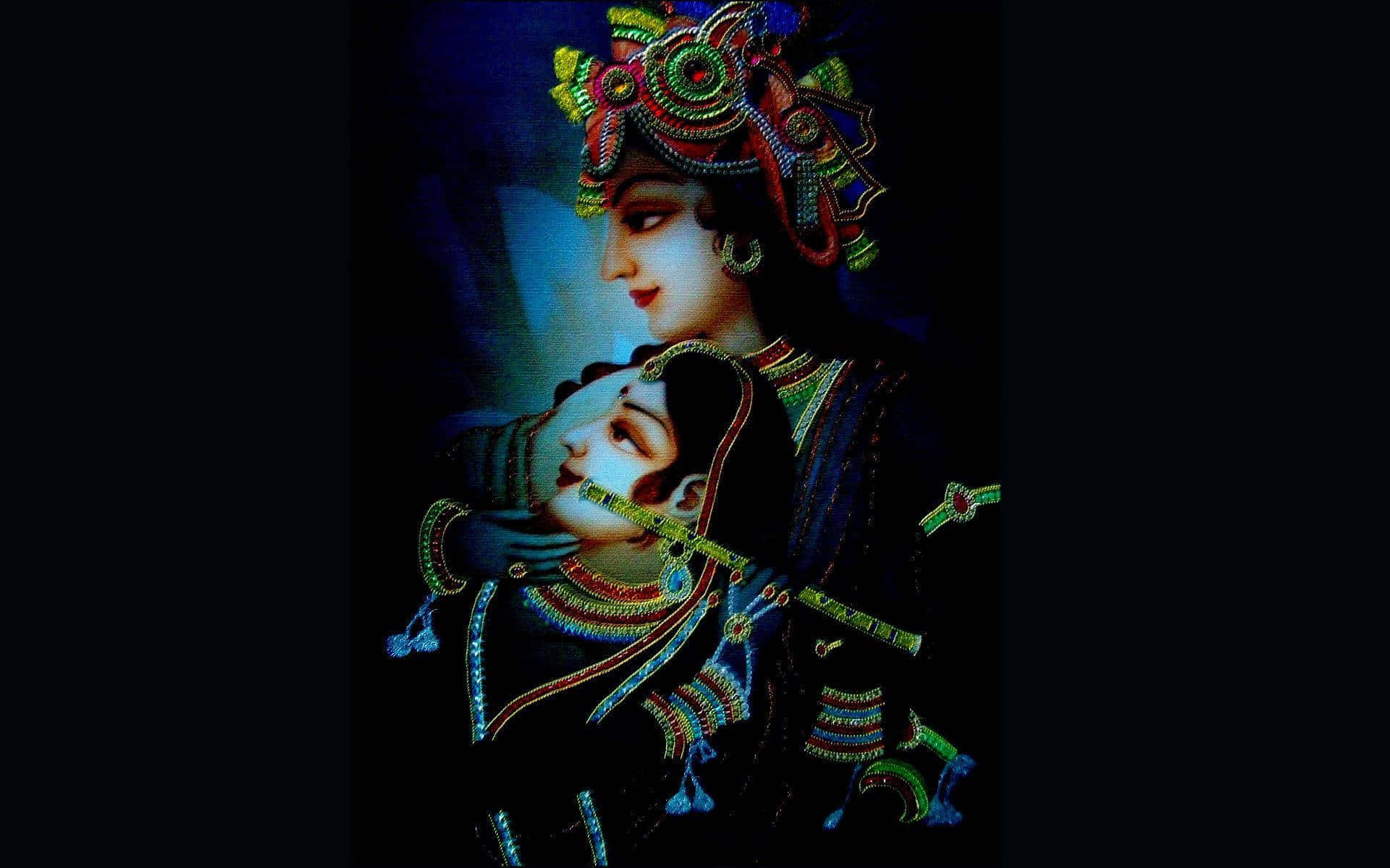 克里希那 桌布 壁紙 — 一對神聖的夫婦身著華麗的傳統服飾，在深藍色背景下擁抱，飾有複雜的珠飾和發光的珠寶。