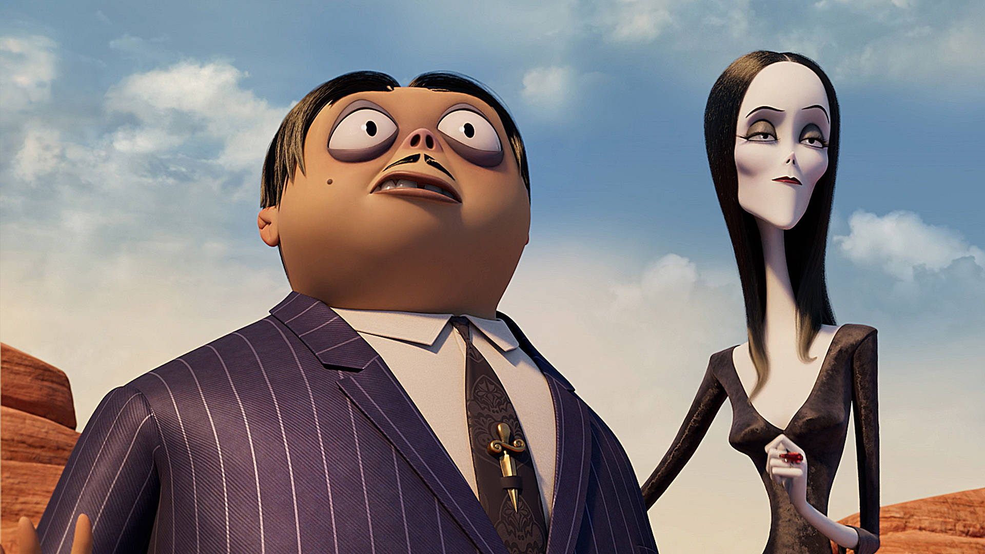 The Addams Family 2 桌布 壁紙 — 一對穿著正式服裝的卡通情侶，以戲劇性的表情站在沙漠天空前。