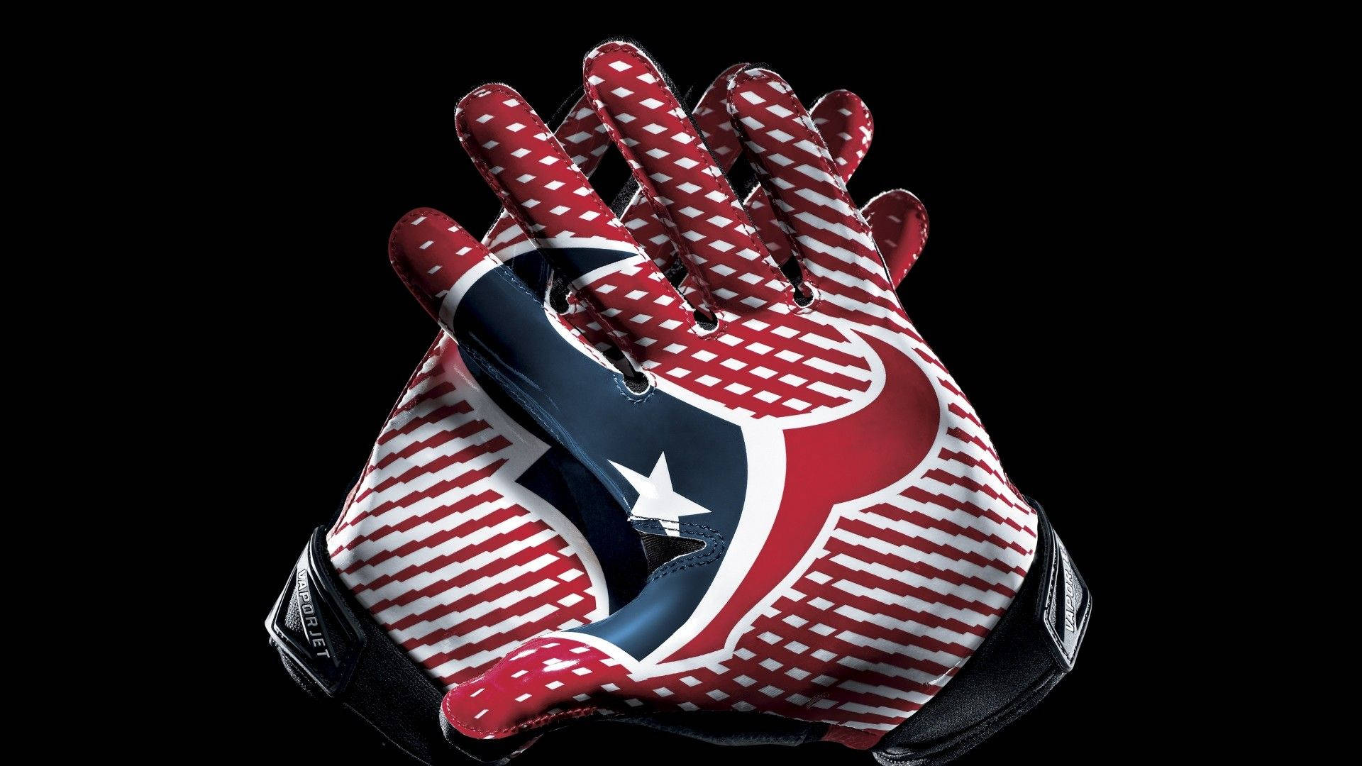 Texans 桌布 壁紙 — 一對紅白藍色足球手套，帶有星星標誌，黑色背景。