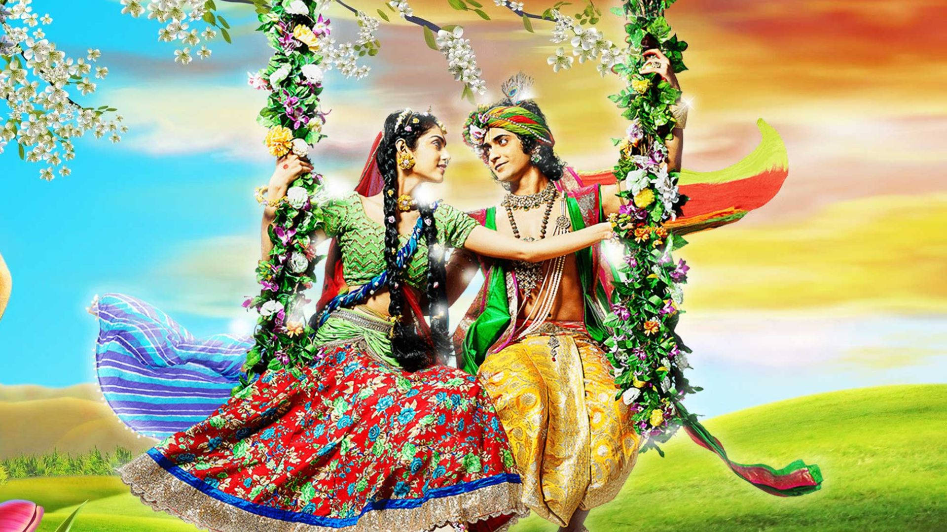 radha krishna serial 桌布 壁紙 — 一對色彩鮮豔的插畫情侶穿著傳統印度服飾，在花飾鞦韆上共享溫馨時刻，背景是色彩繽紛的日落天空。