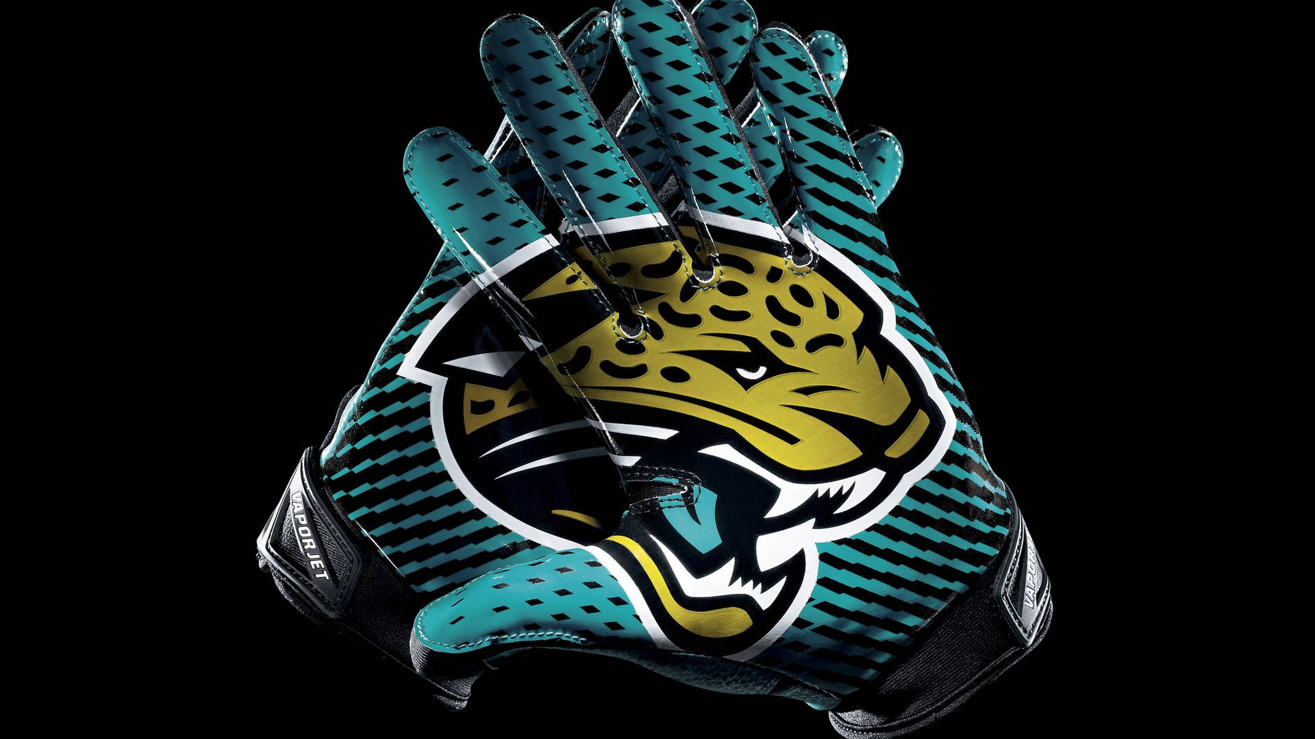 Jaguars 桌布 壁紙 — 一對藍綠色和黑色的傑克遜維爾美洲虎足球手套，中間有一個大膽的美洲虎標誌，背景是純黑色。