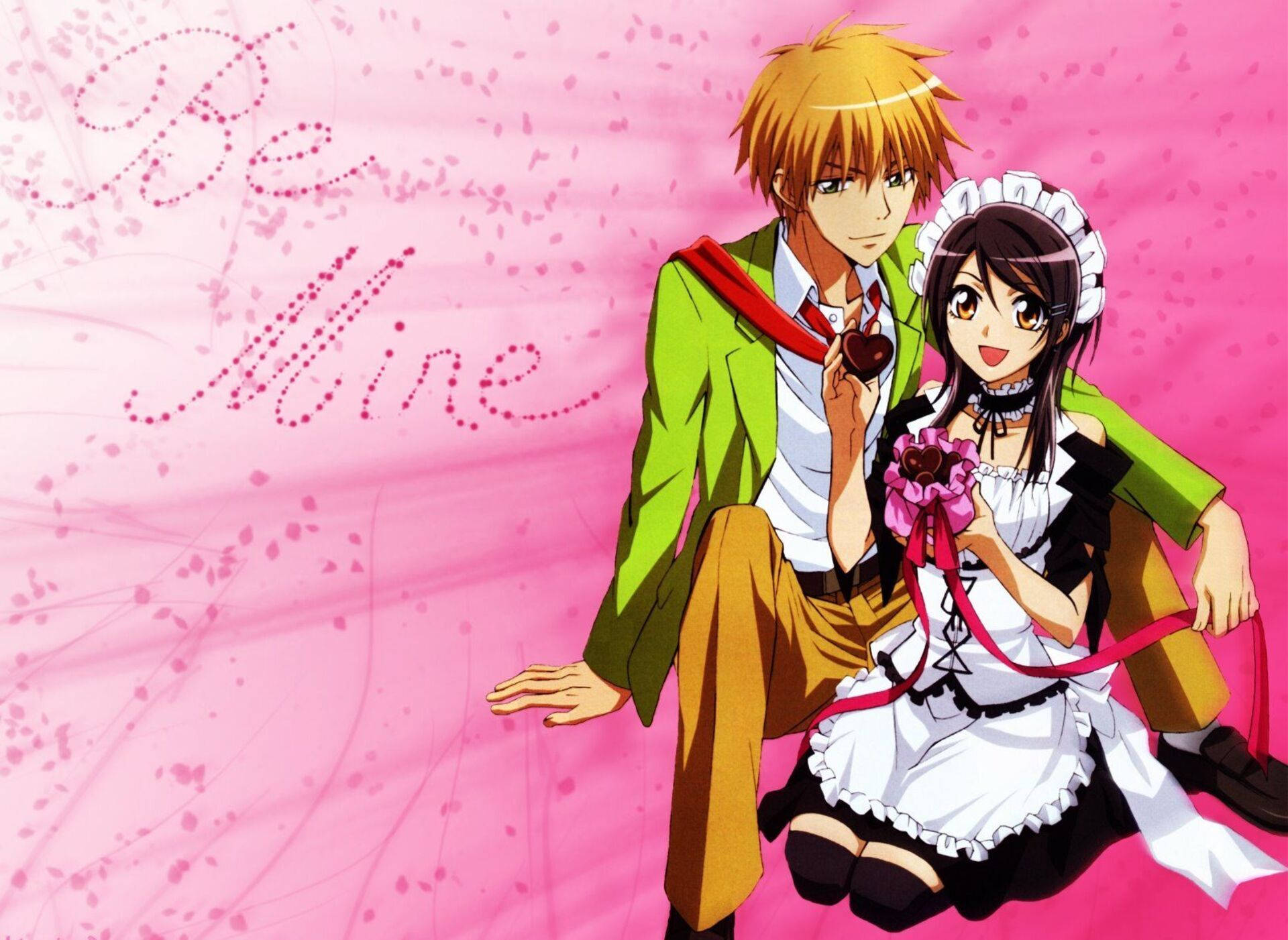 Kaichou Wa Maid Sama 桌布 壁紙 — 一對開心的動漫情侶在粉紅色背景前擺姿勢，帶有「Be Mine」文字和漂浮的心形。