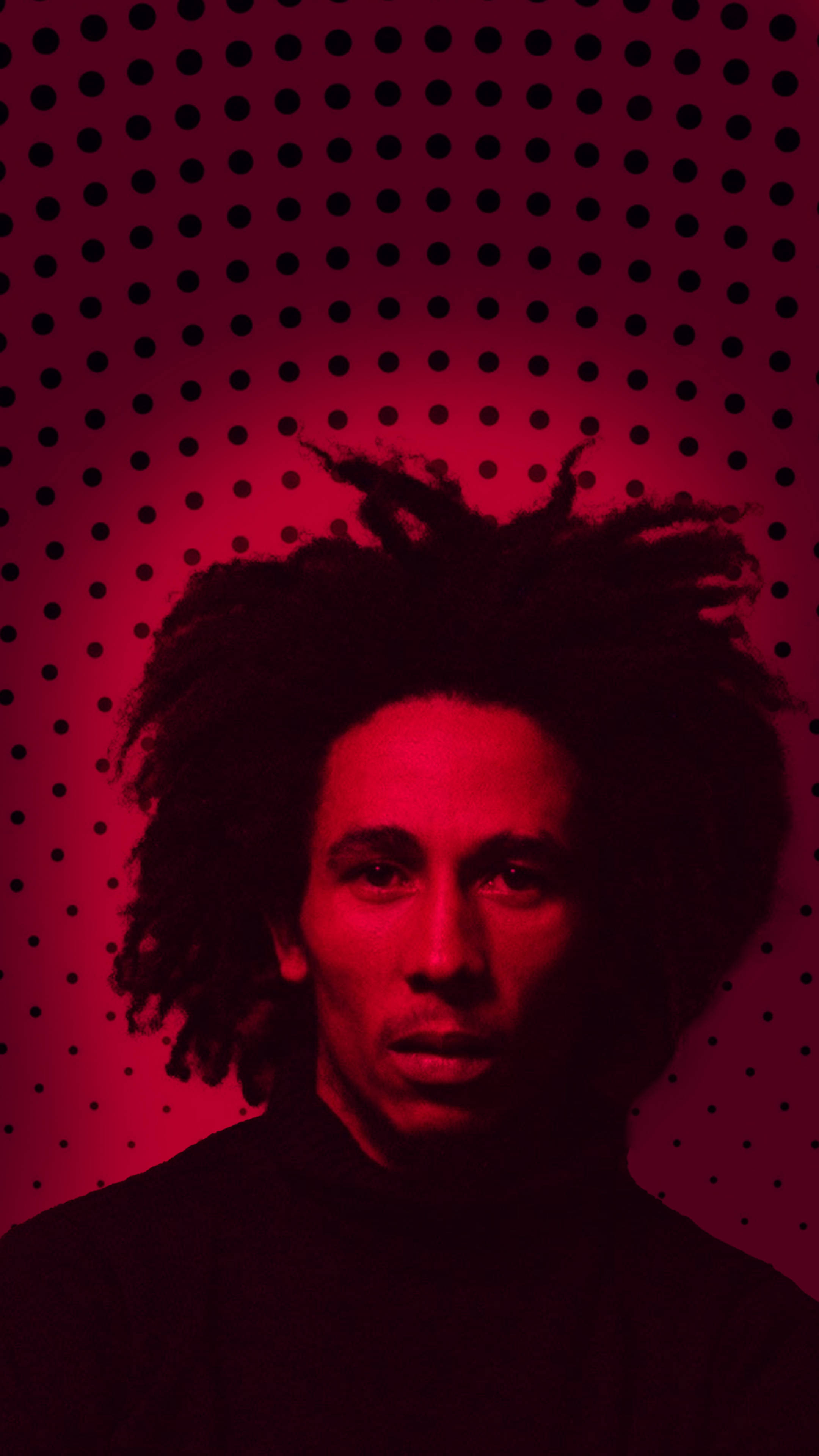 Bob Marley 桌布 壁紙 — 一幅Bob Marley的肖像，沐浴在強烈的紅光中，背景穿孔並帶有黑色圓點。