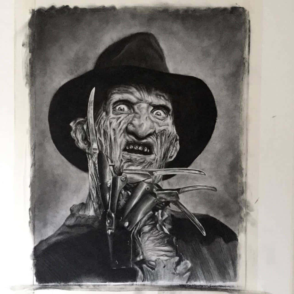 Freddy Krueger 桌布 壁紙 — 一幅令人毛骨悚然的弗雷迪·克魯格木炭肖像，帶有他標誌性的刀片手套和睜大眼睛的威脅笑容。