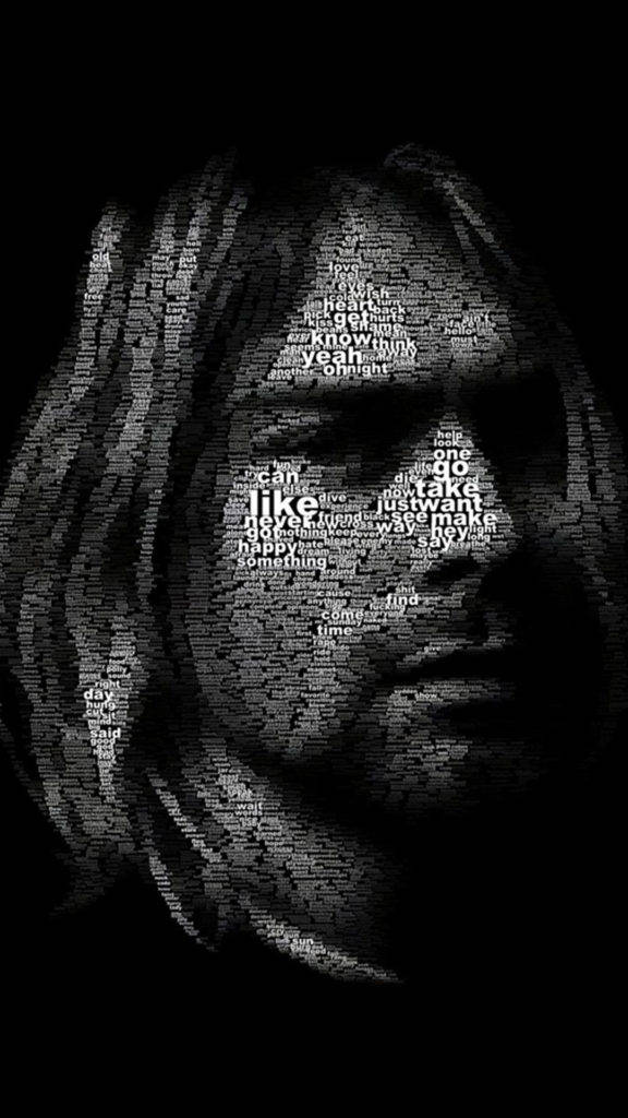 Cobain 桌布 壁紙 — 一幅令人難忘的黑白肖像，由重疊的詞語如愛和快樂組成，形成一個幽靈般的人臉。