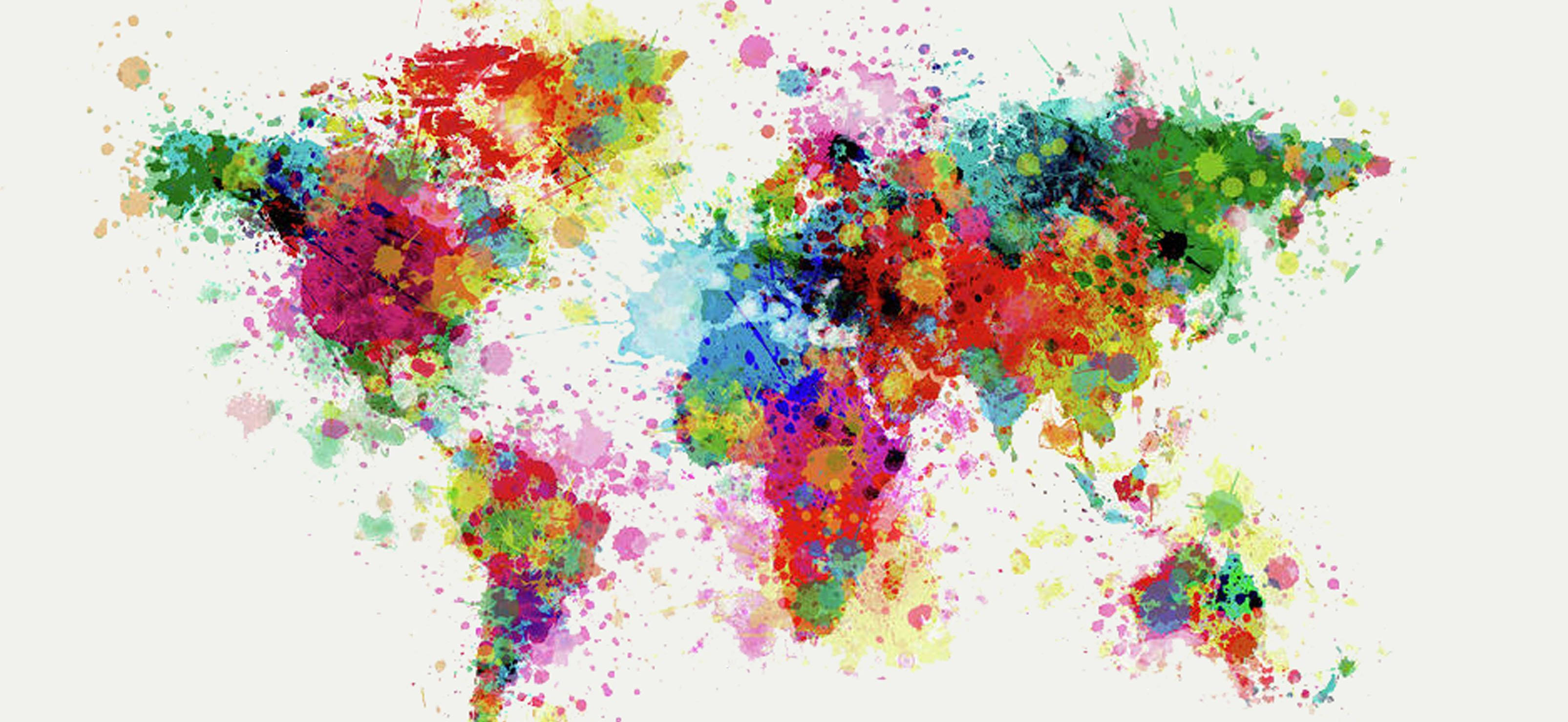 World 桌布 壁紙 — 一幅充滿活力的世界地圖，以色彩繽紛的油漆飛濺在淺色背景上呈現。