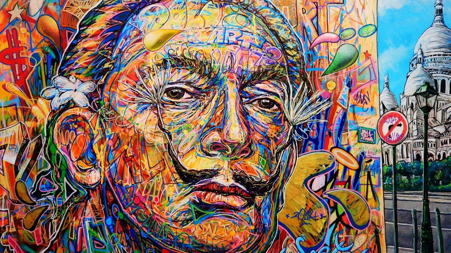 Dali 桌布 壁紙 — 一幅充滿活力的塗鴉壁畫，描繪一個留鬍子、帶有蒲公英絨毛的男人面孔，旁邊是巴黎街景和聖心堂。
