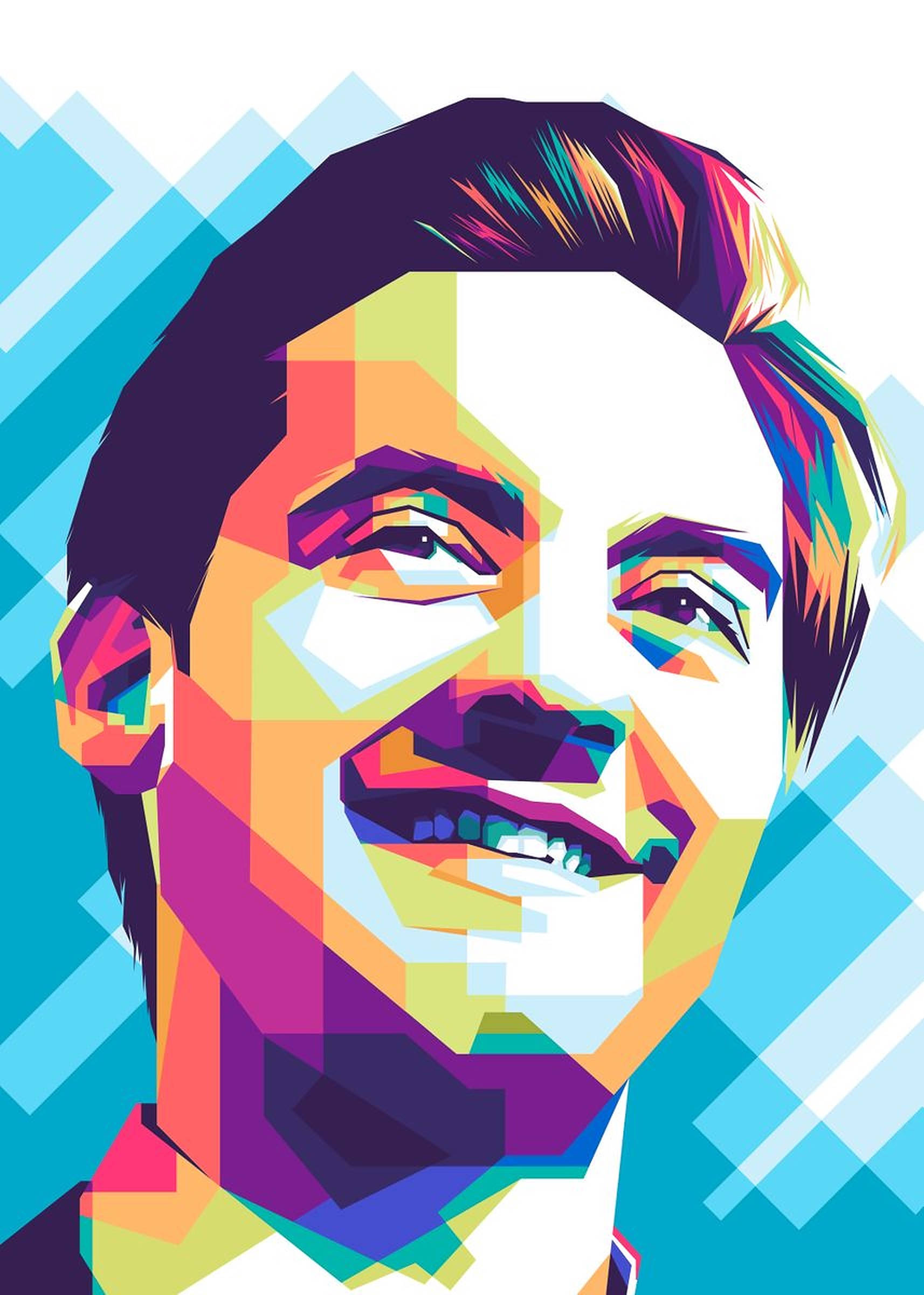 Tobey Maguire 桌布 壁紙 — 一幅充滿活力的幾何肖像，描繪一位微笑的男子，帶有彩虹色塊，背景為藍色對角線。