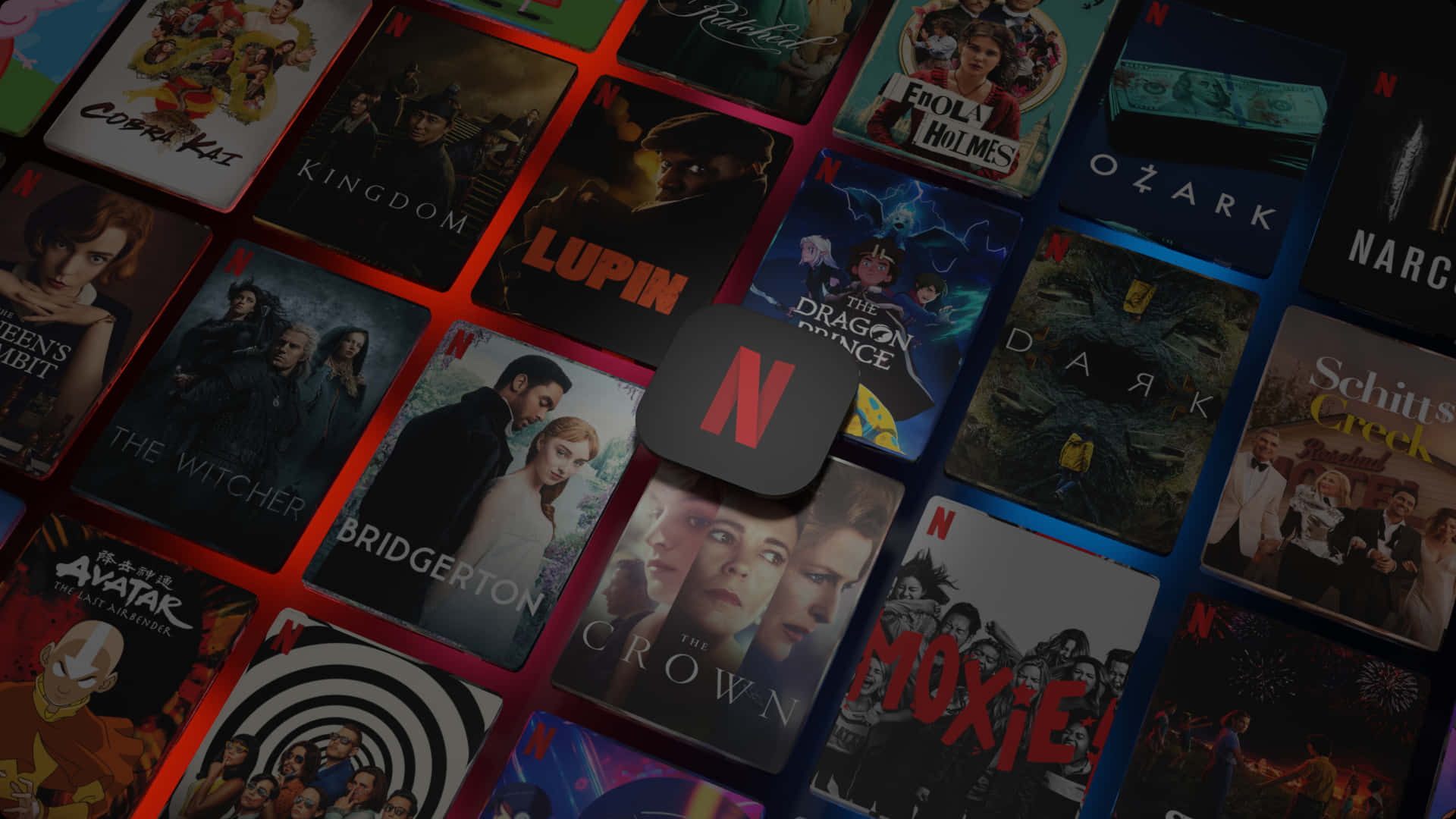 Netflix 桌布 壁紙 — 一幅充滿活力的拼貼畫，由Netflix節目封面以網格排列，標誌性的紅色Netflix標誌居中突出顯示。