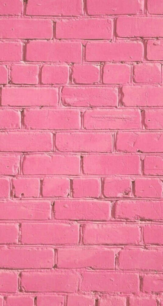 Pink Brick 桌布 壁紙 — 一幅充滿活力的粉紅色油漆磚牆的特寫，可見砂漿線和紋理。