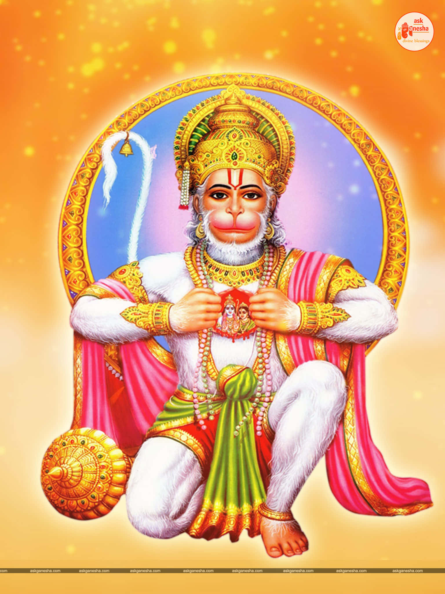 Hanuman 桌布 壁紙 — 一幅光彩奪目的插圖，描繪印度教神祇哈努曼盤腿而坐，身穿華麗的金色和粉紅色服飾，手持神聖圖標，背景是發光的橙色和藍色光環。