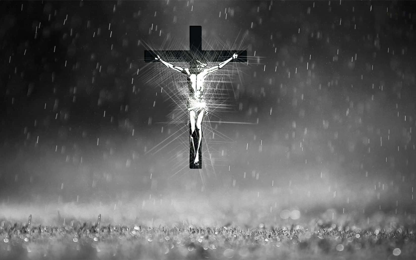 黑白 桌布 壁紙 — 一幅單色雨中的發光 crucifixion 場景，光線從人物身上散發，背景是霧氣瀰漫的地面。