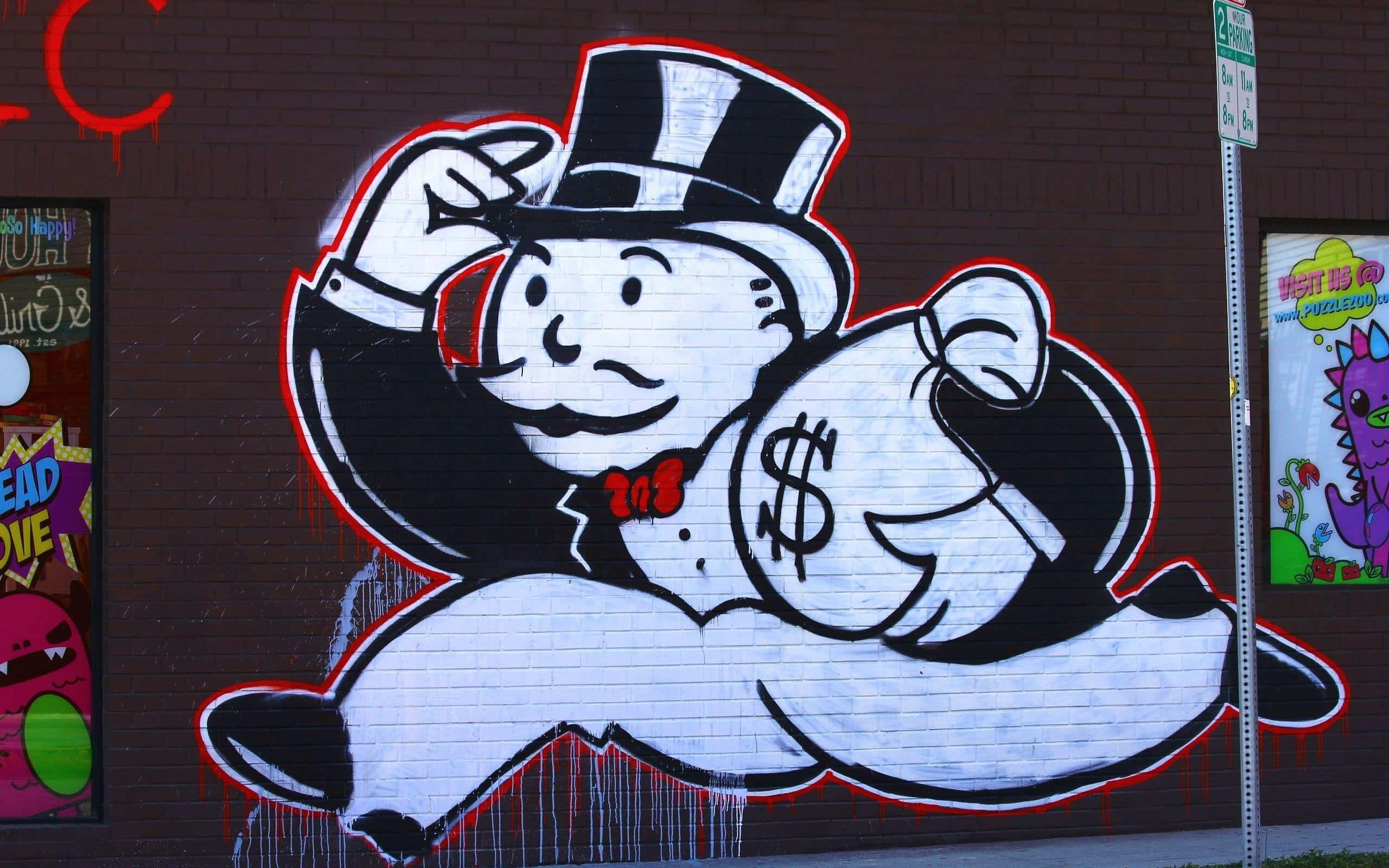 Monopoly Man 桌布 壁紙 — 一幅大膽的塗鴉壁畫，描繪大富翁先生，以黑、白、紅色在磚牆上，帶有滴漆效果。
