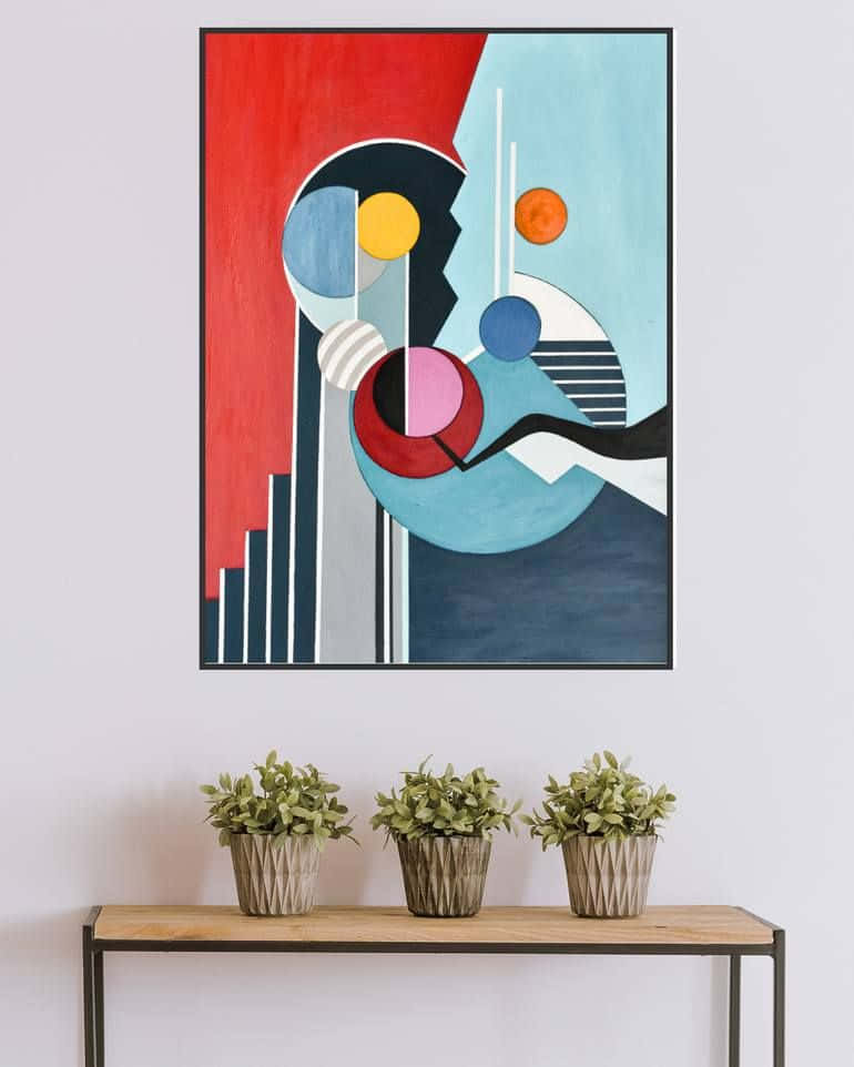 Modern Minimalist Art 桌布 壁紙 — 一幅大膽紅、藍、黃色幾何形狀的抽象藝術品掛在木製玄關桌上，桌上放有三盆盆栽植物。