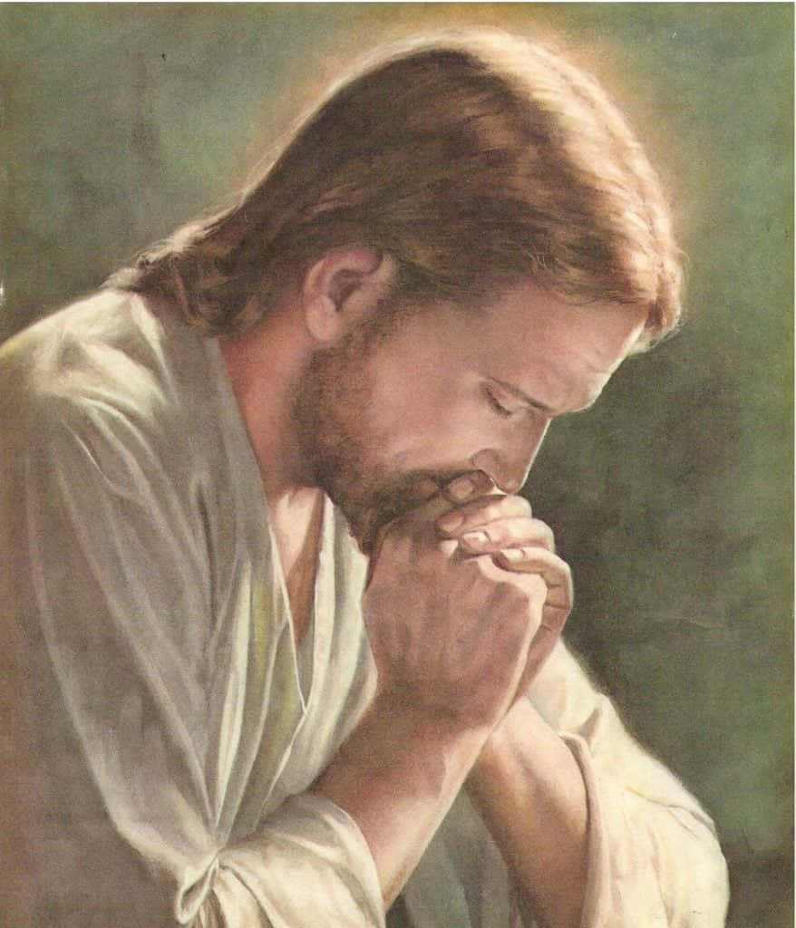 Jesus Praying 桌布 壁紙 — 一幅寧靜的油畫，描繪耶穌在祈禱，雙手合十，低頭，背景為柔和的綠色。