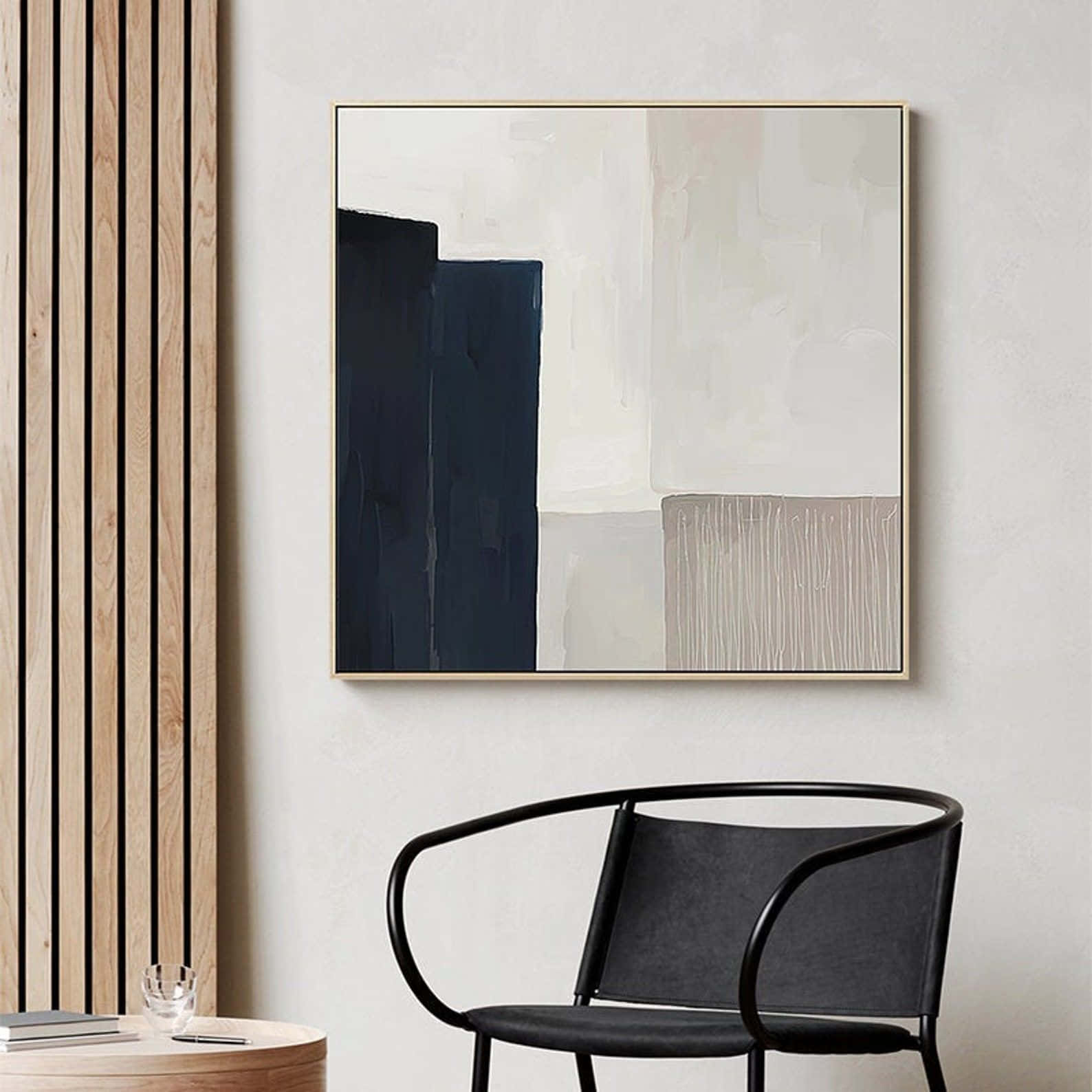 Modern Minimalist Art 桌布 壁紙 — 一幅極簡抽象畫，帶有海軍藍、米色和奶油色塊，掛在現代室內設計中的黑色椅子上方。