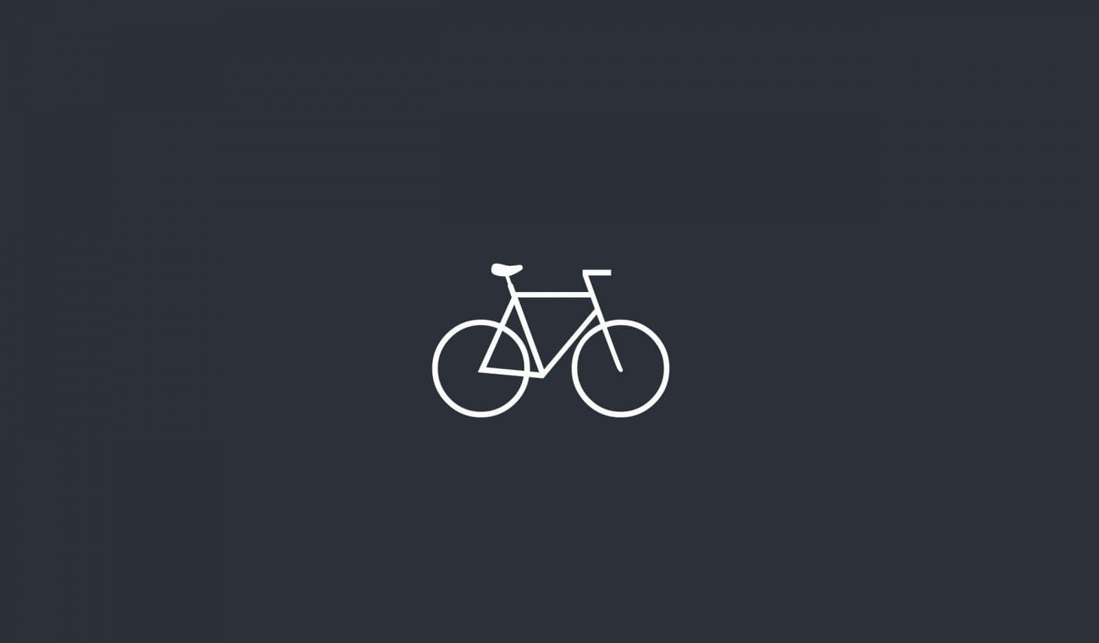 Bikes 桌布 壁紙 — 一幅極簡的白色線條腳踏車圖案，置中於純深灰色背景上。