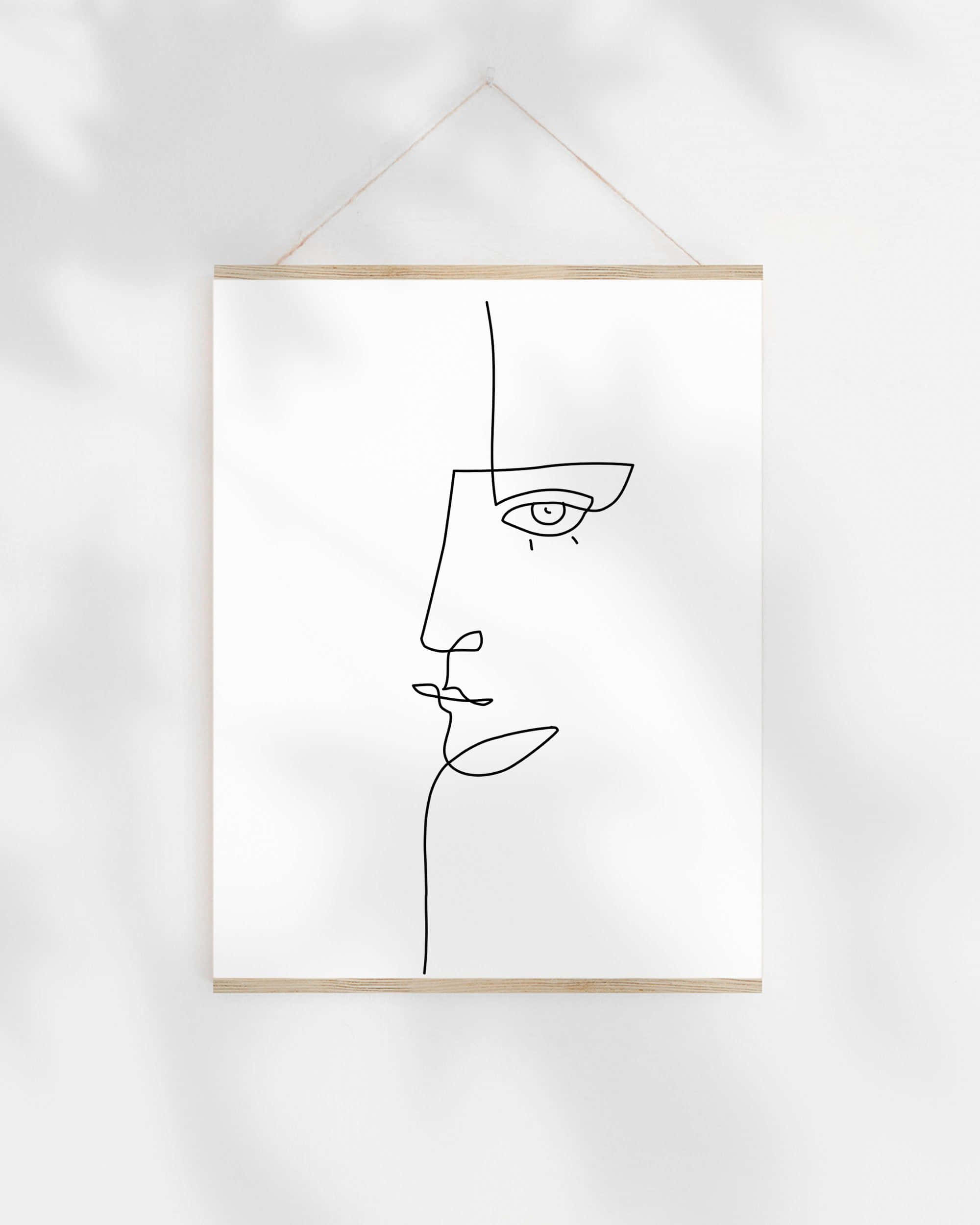 Modern Minimalist Art 桌布 壁紙 — 一幅極簡線條畫的人臉掛在白色牆上，帶有附近葉子投射的柔和陰影圖案。