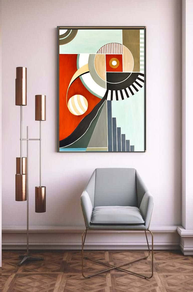 Modern Minimalist Art 桌布 壁紙 — 一幅現代抽象畫，帶有鮮明的幾何形狀和溫暖色調，懸掛在簡約室內設計中，位於一張時尚灰色椅子之上，旁邊是一盞黃銅落地燈。