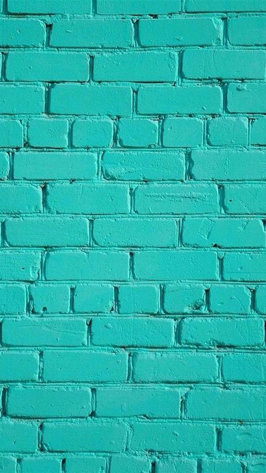 Brick Wall 桌布 壁紙 — 一幅磚牆的特寫，牆面漆上鮮豔的藍綠色，可見紋理和砂漿線。