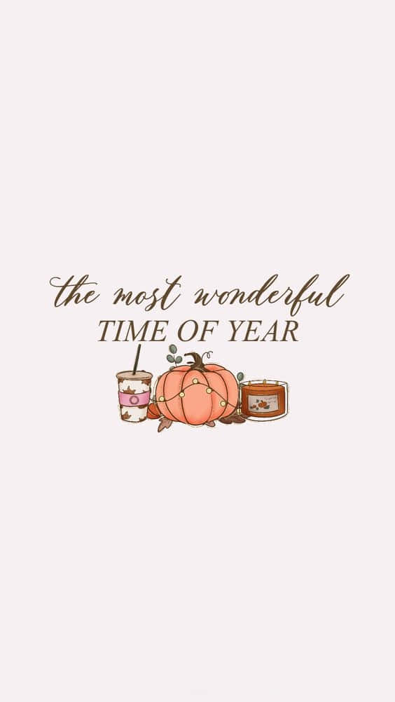 桌布 壁紙 — 一幅舒適的秋季主題插圖，包含南瓜蠟燭飲品和文字 'the most wonderful time of year'。