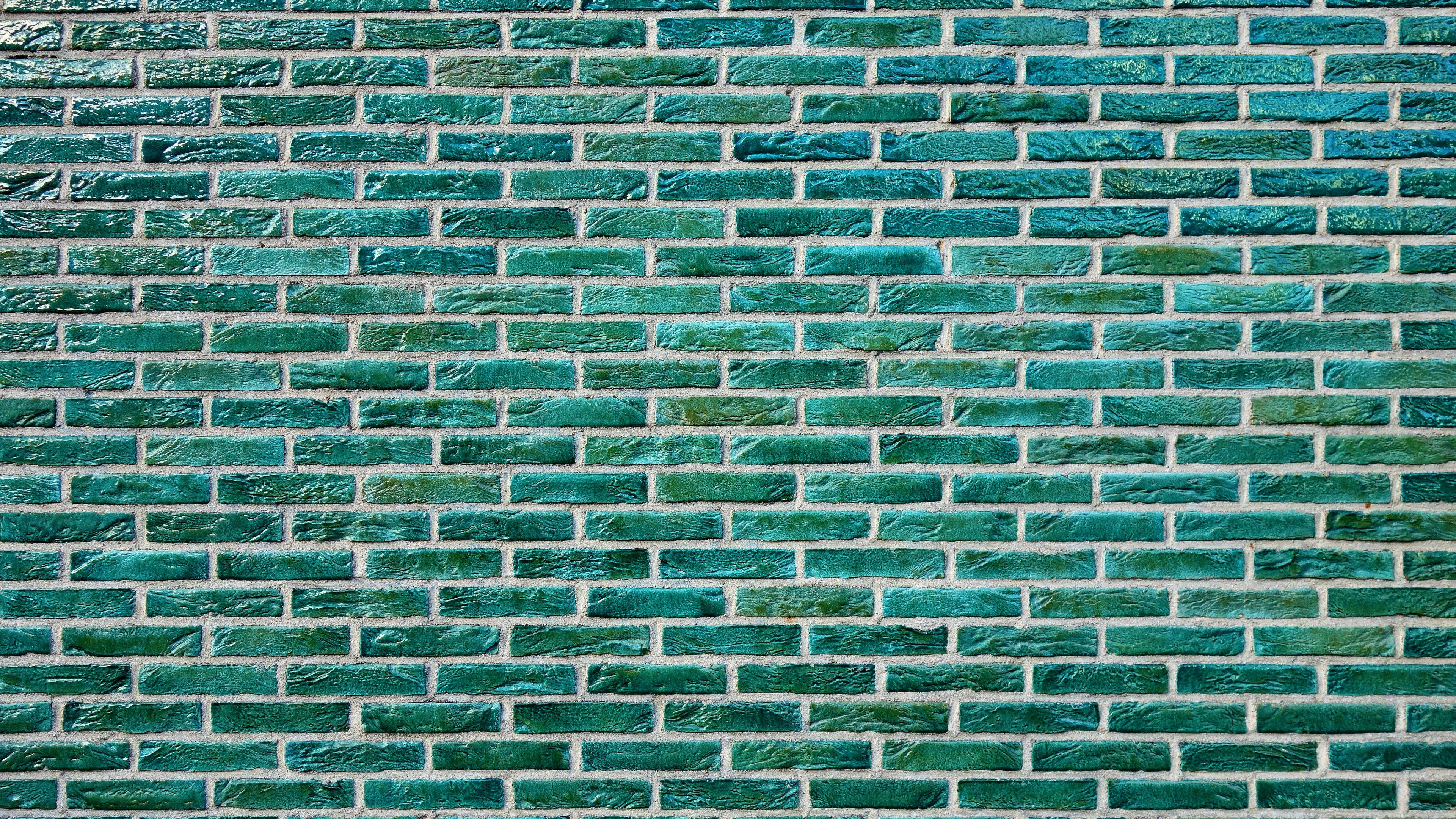 Brick Wall 桌布 壁紙 — 一幅覆蓋著青綠色釉面磚的牆壁特寫，白色砂漿線條形成紋理圖案。