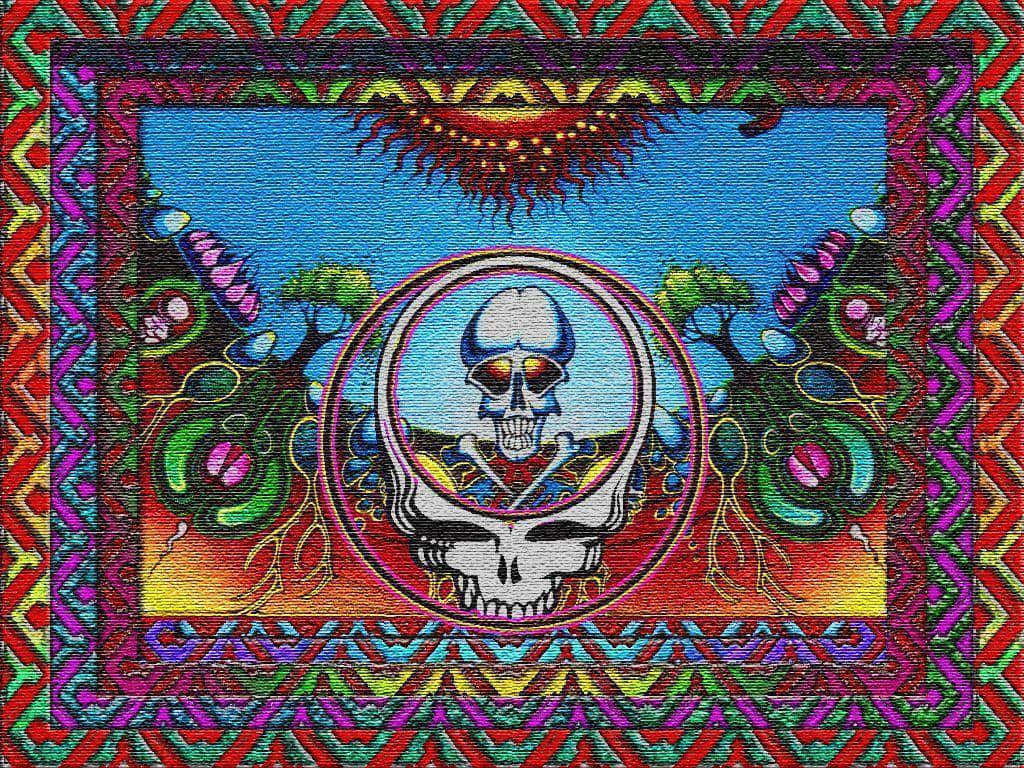 Grateful Dead iPhone 桌布 壁紙 — 一幅迷幻掛毯中央有一個發光的頭骨，周圍環繞著鮮豔的幾何邊框和超現實的植物，在燦爛的陽光下。