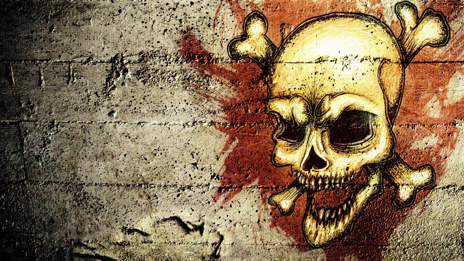 HD Skull 桌布 壁紙 — 一幅金色骷髏頭骨交叉圖案的塗鴉壁畫，在風化的混凝土牆上濺滿紅色油漆。