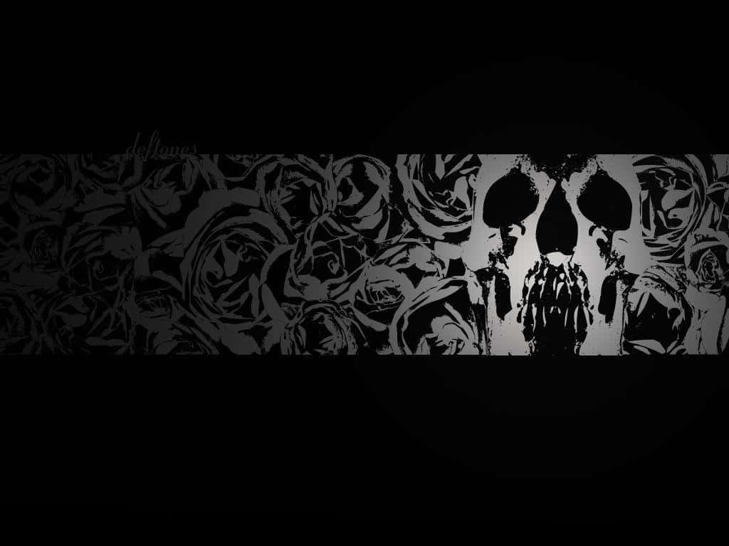 deftones 桌布 壁紙 — 一幅鮮明的黑白壁紙，中央有一個被玫瑰包圍的骷髏剪影，背景為深色。