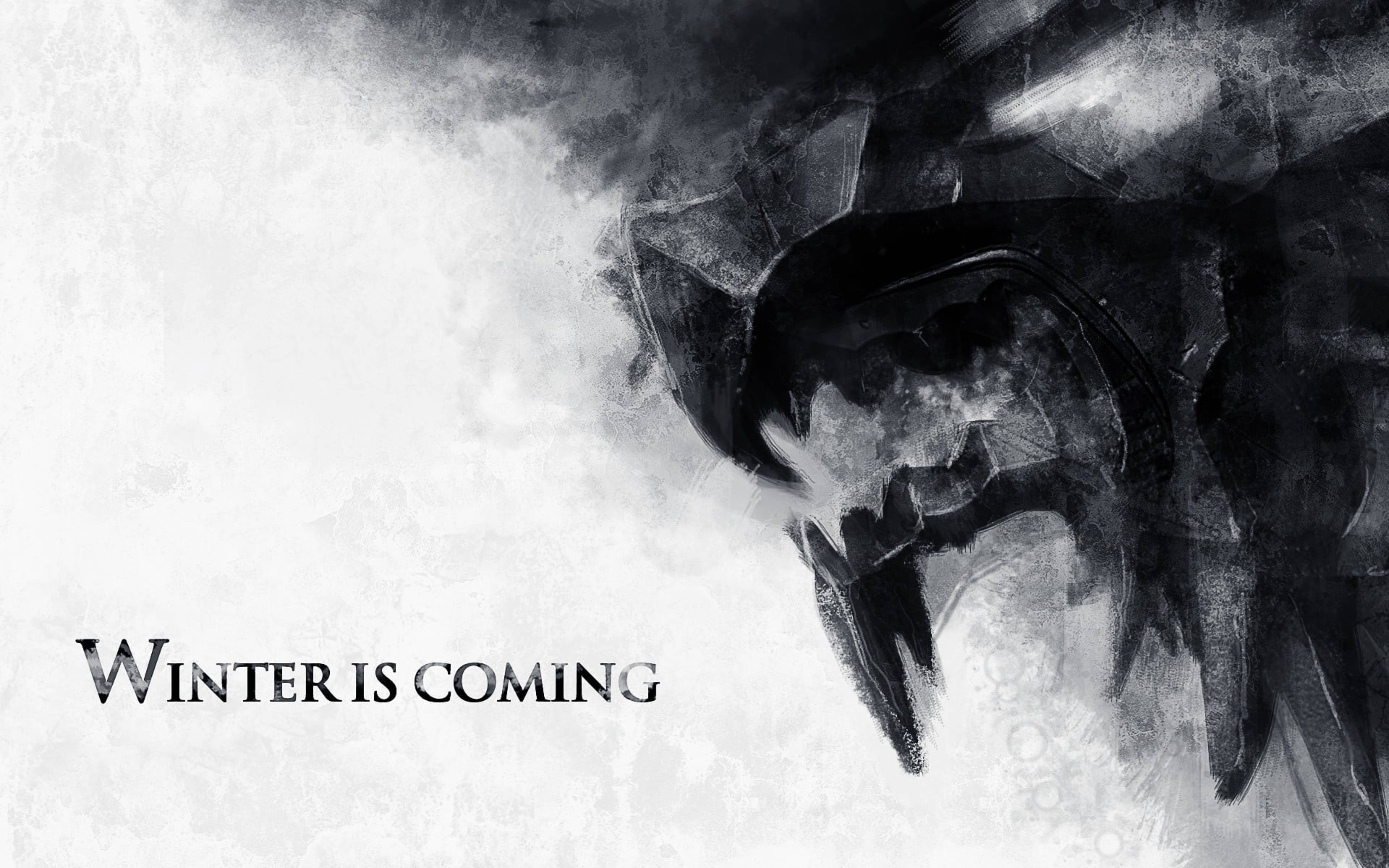 House Stark 桌布 壁紙 — 一幅鮮明的黑白插圖，描繪一個冰冷、威嚇的冰原狼剪影，襯以有紋理的雪地背景，並以粗體字寫著「WINTER IS COMING」。