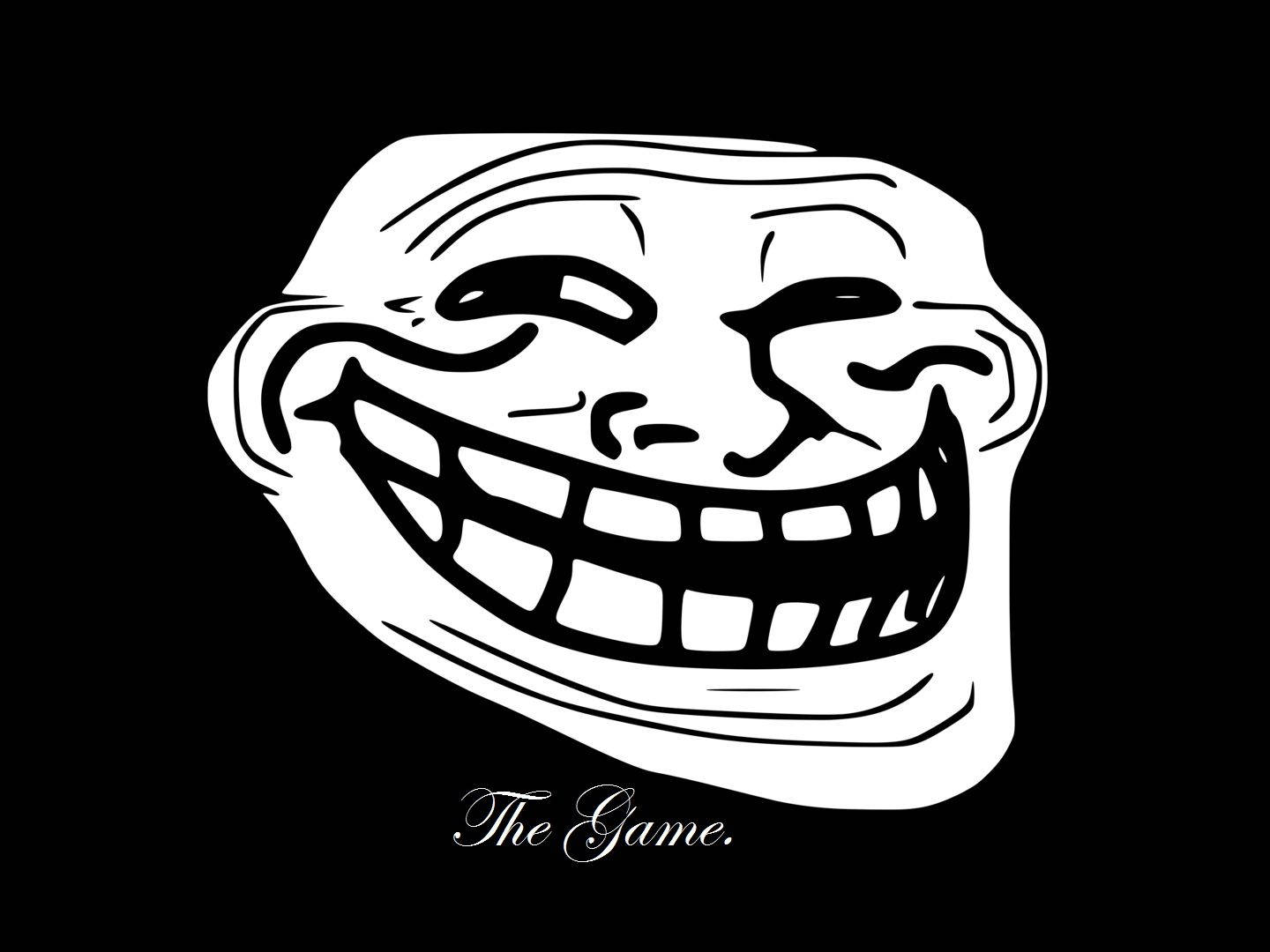 Troll Face 桌布 壁紙 — 一幅鮮明的黑白插圖，描繪了標誌性的 troll 臉，咧嘴大笑，下方有文字 The Game。