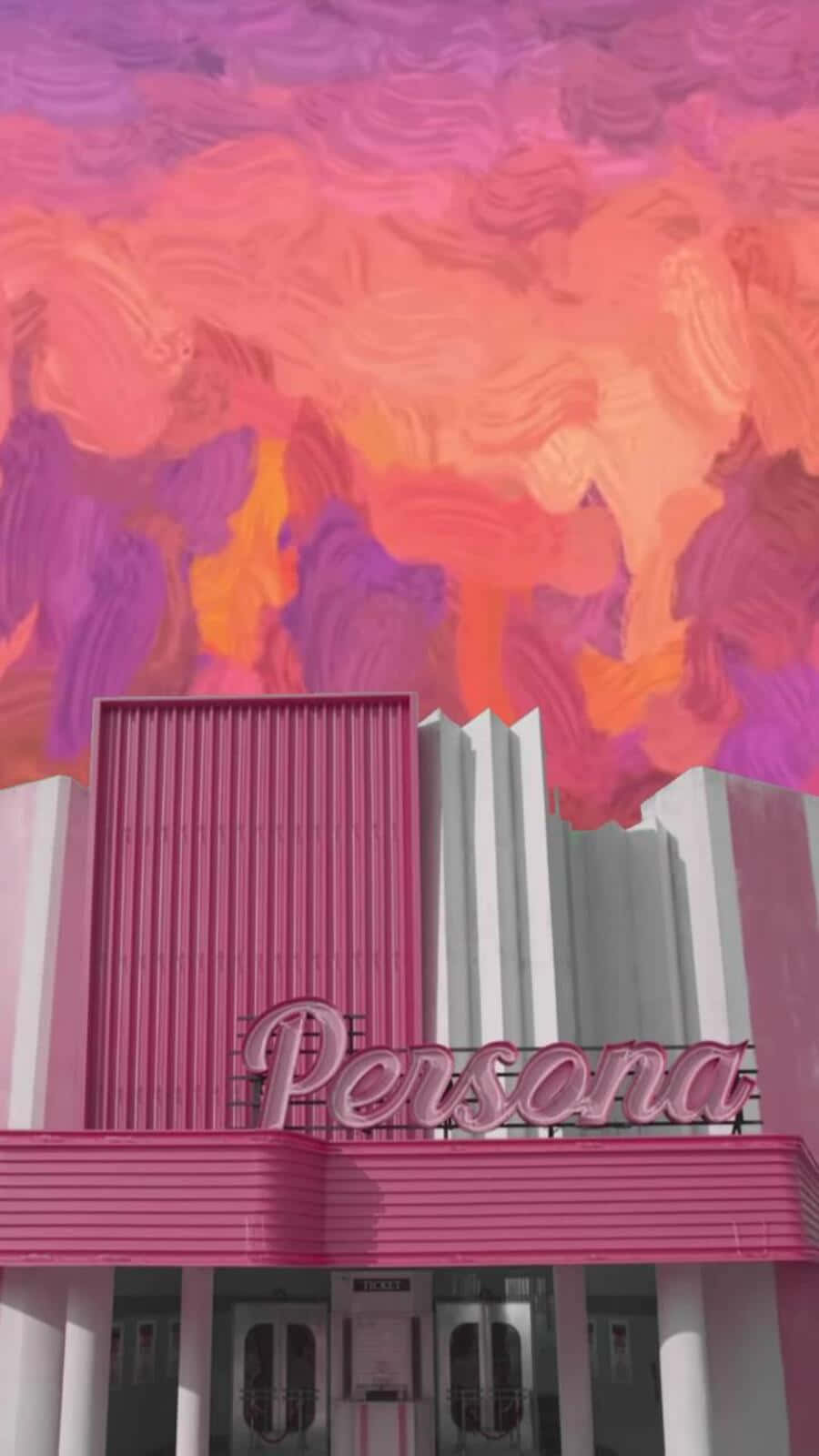 Bts Mv 桌布 壁紙 — 一座名為「Persona」的粉白相間裝飾藝術風格劇院，矗立在洋紅色、橙色和紫色的生動漩渦狀日落天空下。