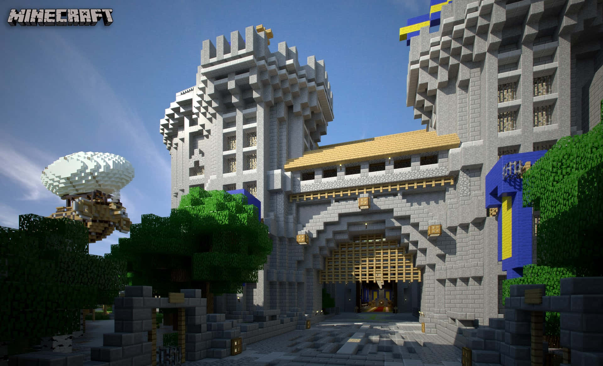 Minecraft Map 桌布 壁紙 — 一座宏偉的Minecraft城堡，擁有灰色石塔和金色大門，在晴朗的藍天下。