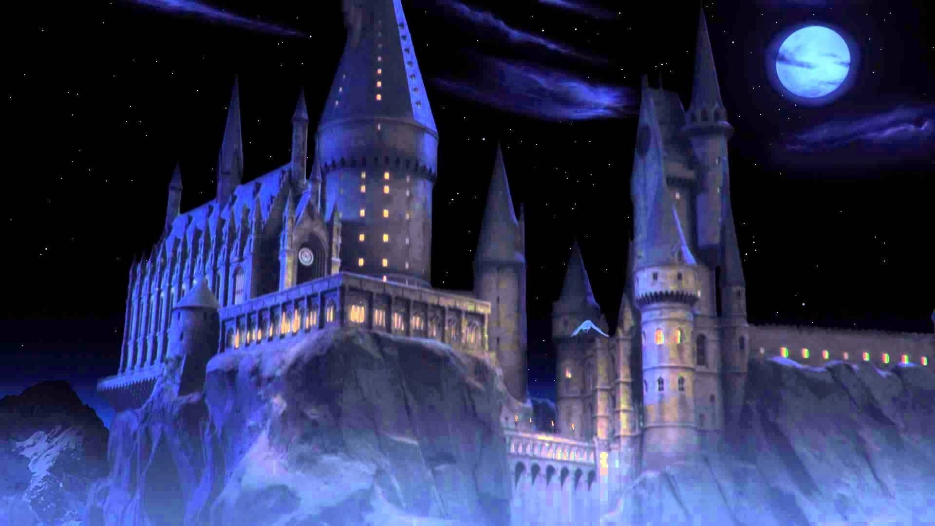 Universal 桌布 壁紙 — 一座宏偉的哥德式城堡坐落在雪崖上，星空下閃耀著藍色月亮。