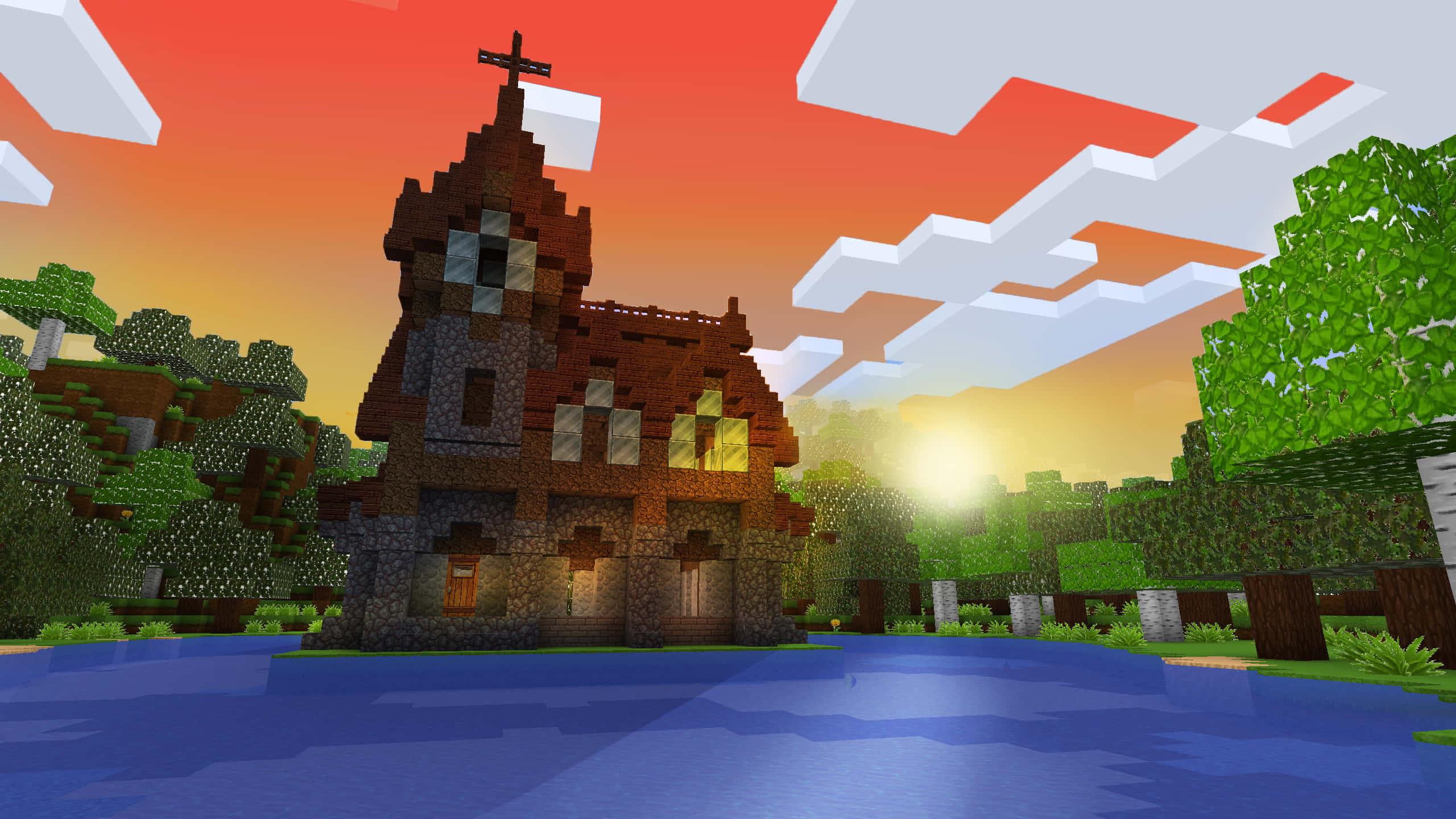 桌布 壁紙 — 一座帶有十字架的像素化Minecraft教堂在日落時分矗立在水邊，周圍有方塊狀的樹木和雲朵。