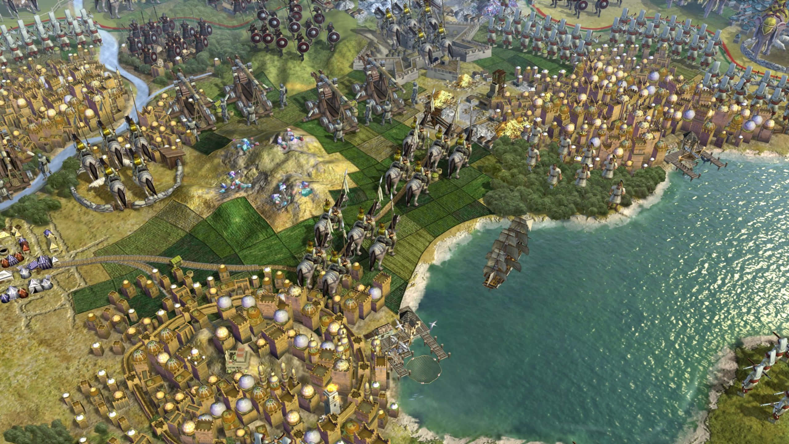 1440p Civilization V 桌布 壁紙 — 一座廣闊的中世紀奇幻城市，擁有城堡、船隻和軍隊，在海灣附近進行戰鬥。