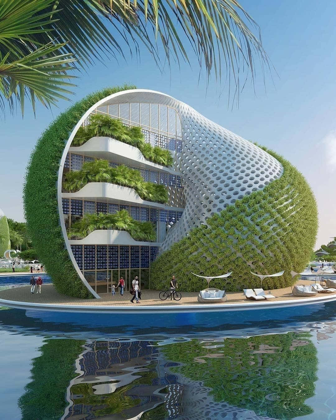 Green Buildings 桌布 壁紙 — 一座未來主義的弧形建築，覆蓋著綠植和穿孔白色面板，漂浮在水面上，上方有棕櫚樹。