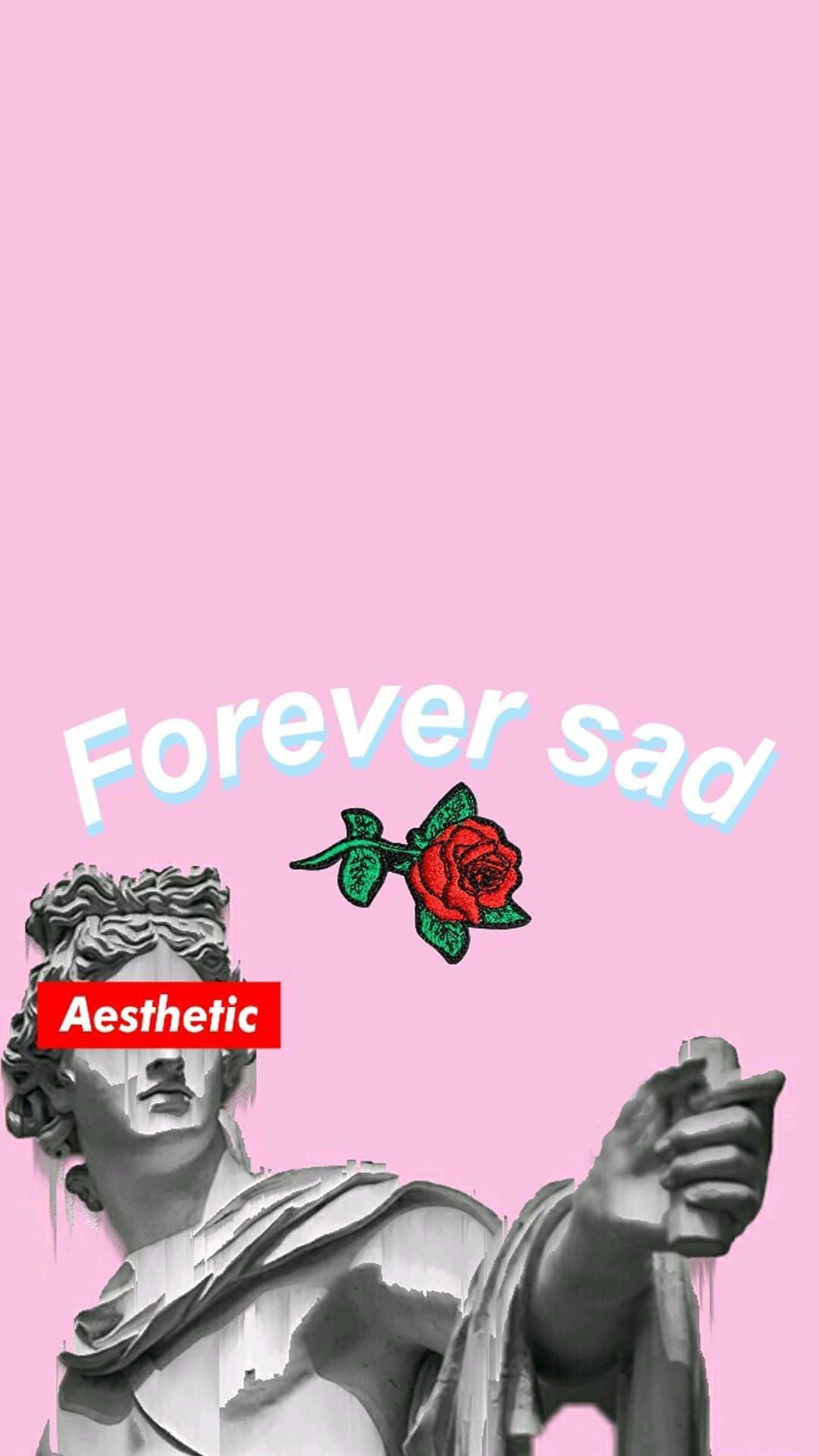 Sad Tumblr 桌布 壁紙 — 一座灰階古典雕像手持一朵紅玫瑰，背景為柔和的粉紅色，並帶有淡藍色的文字「Forever sad」。