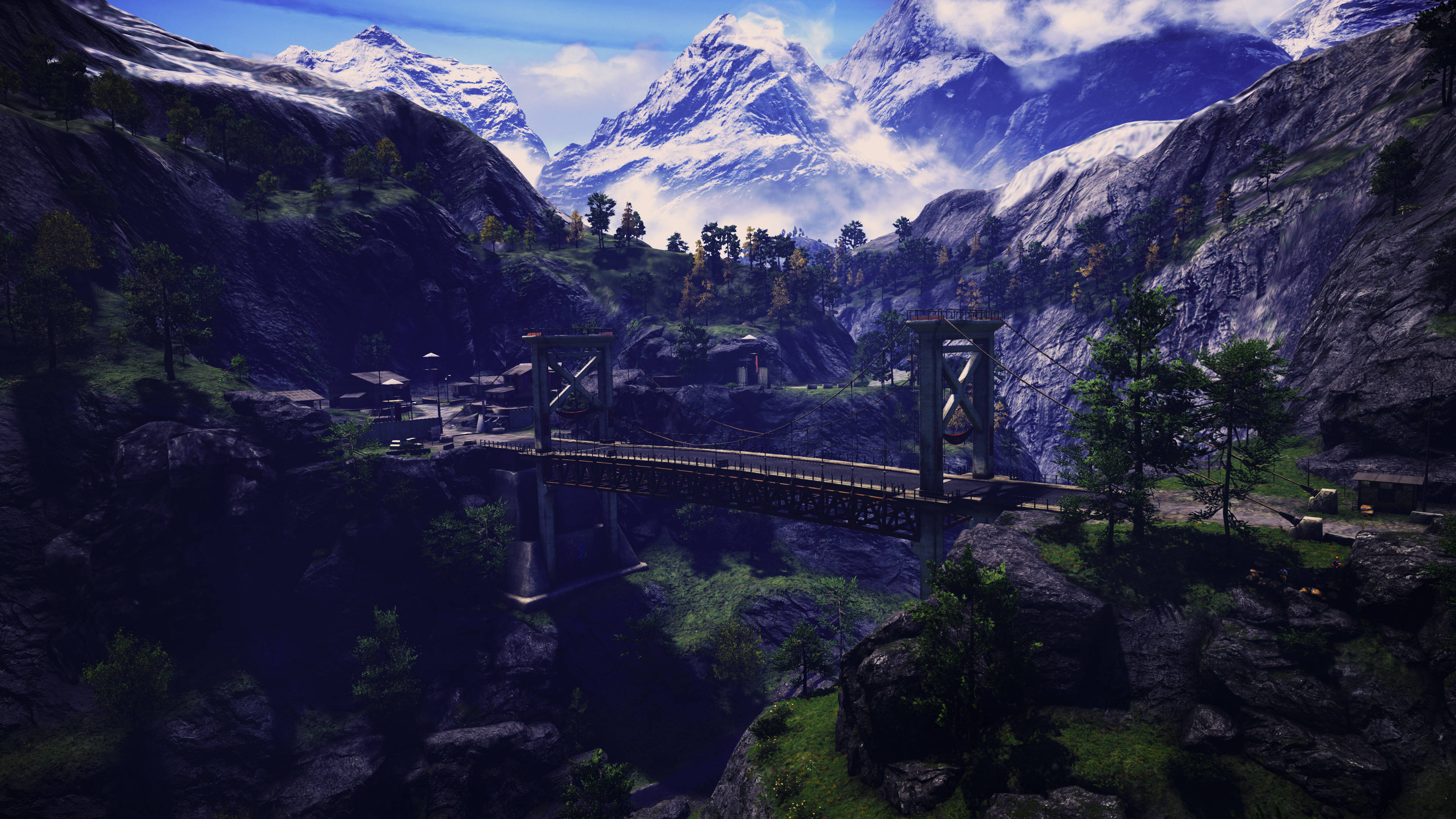 Far Cry 4 桌布 壁紙 — 一座鋼索吊橋橫跨深谷，谷中有雪峰和霧谷，上方是明亮的藍天。