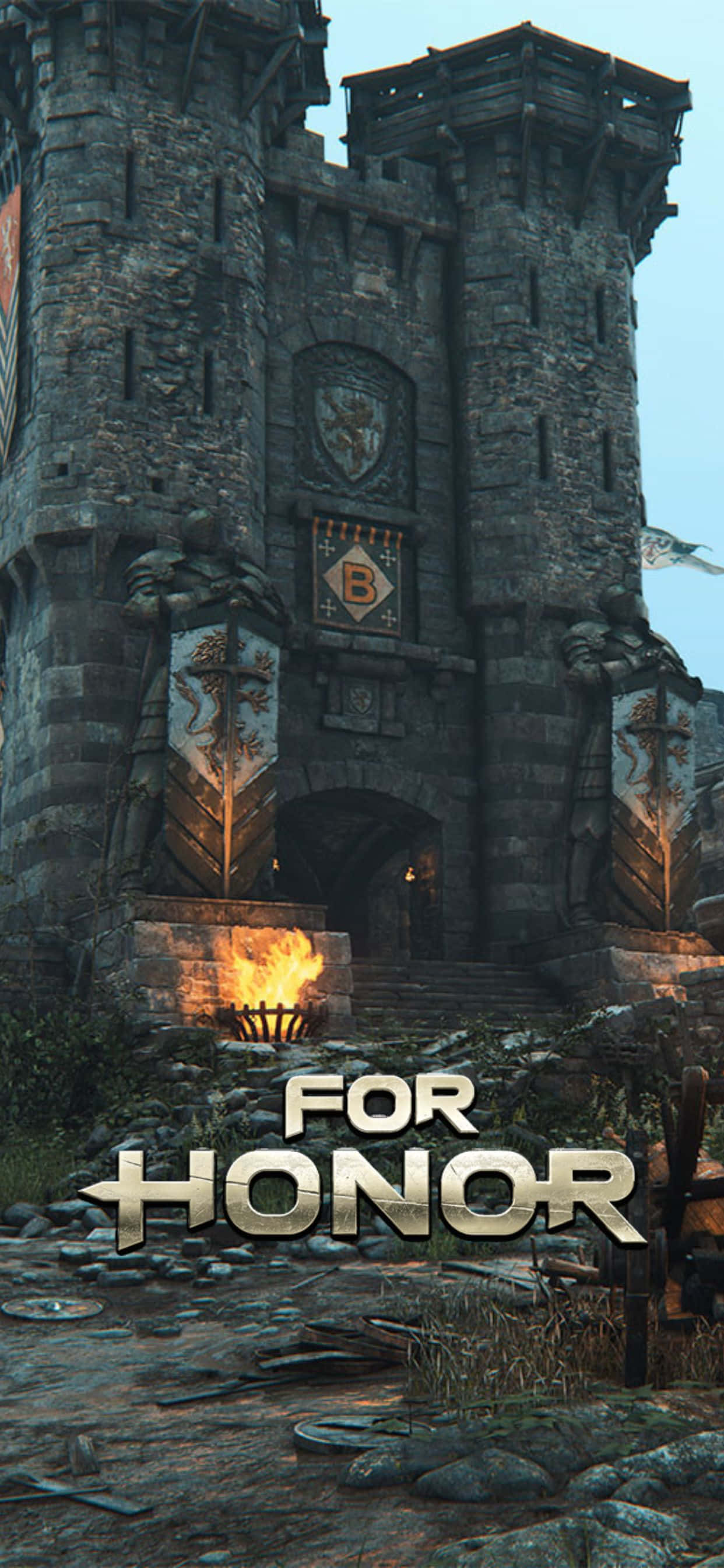 iPhone Xs Max For Honor 桌布 壁紙 — 一座高聳的中世紀石城堡入口，兩側有燃燒的火把和身穿盔甲的雕像，拱門宏偉。