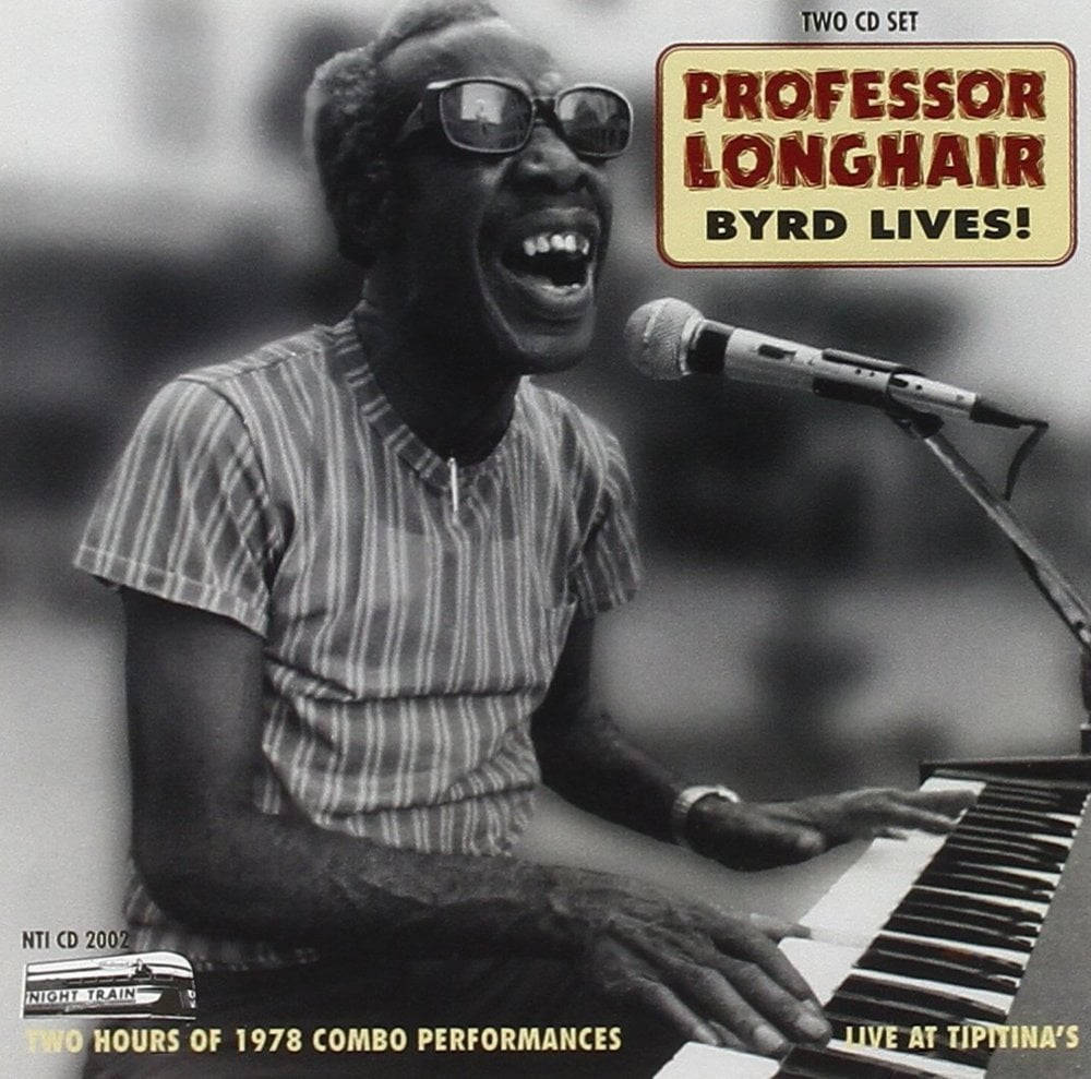Singing 桌布 壁紙 — 一張1978年在Tipitina's現場彈鋼琴時大笑的Professor Longhair的歡樂黑白照片。