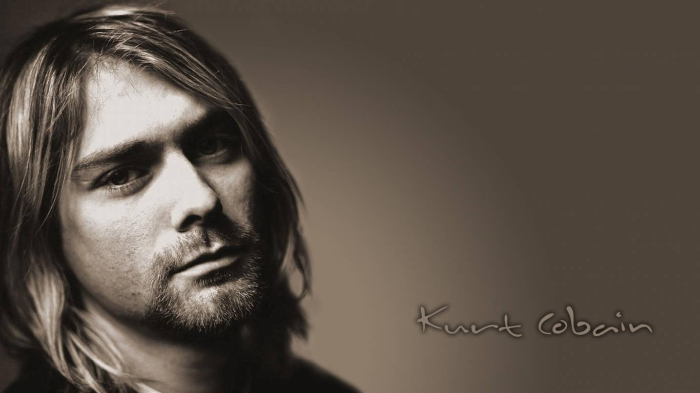 Cobain 桌布 壁紙 — 一張以柔和漸變背景襯托的Kurt Cobain棕褐色調肖像，長髮且帶沉思目光。