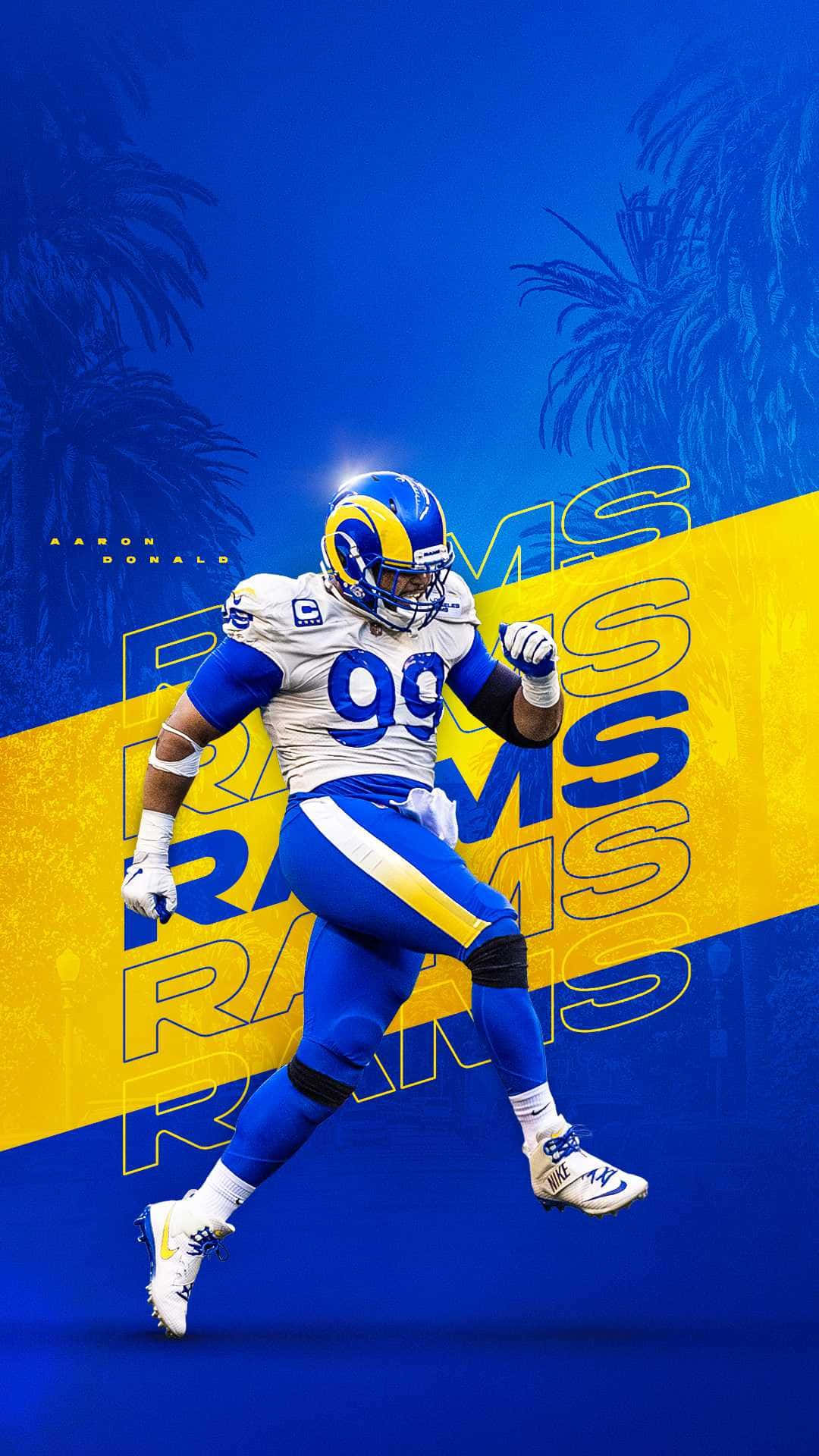 Cool Rams 桌布 壁紙 — 一張動態數位插圖，描繪NFL球員亞倫·唐納德身穿洛杉磯公羊隊球衣，在藍黃鮮明背景襯托下衝刺，背景有棕櫚樹剪影。