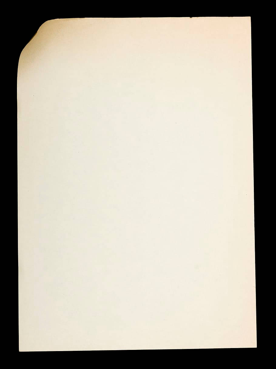 paper 桌布 壁紙 — 一張單獨的米白色紙張，頂角捲曲，放在純黑色背景上。