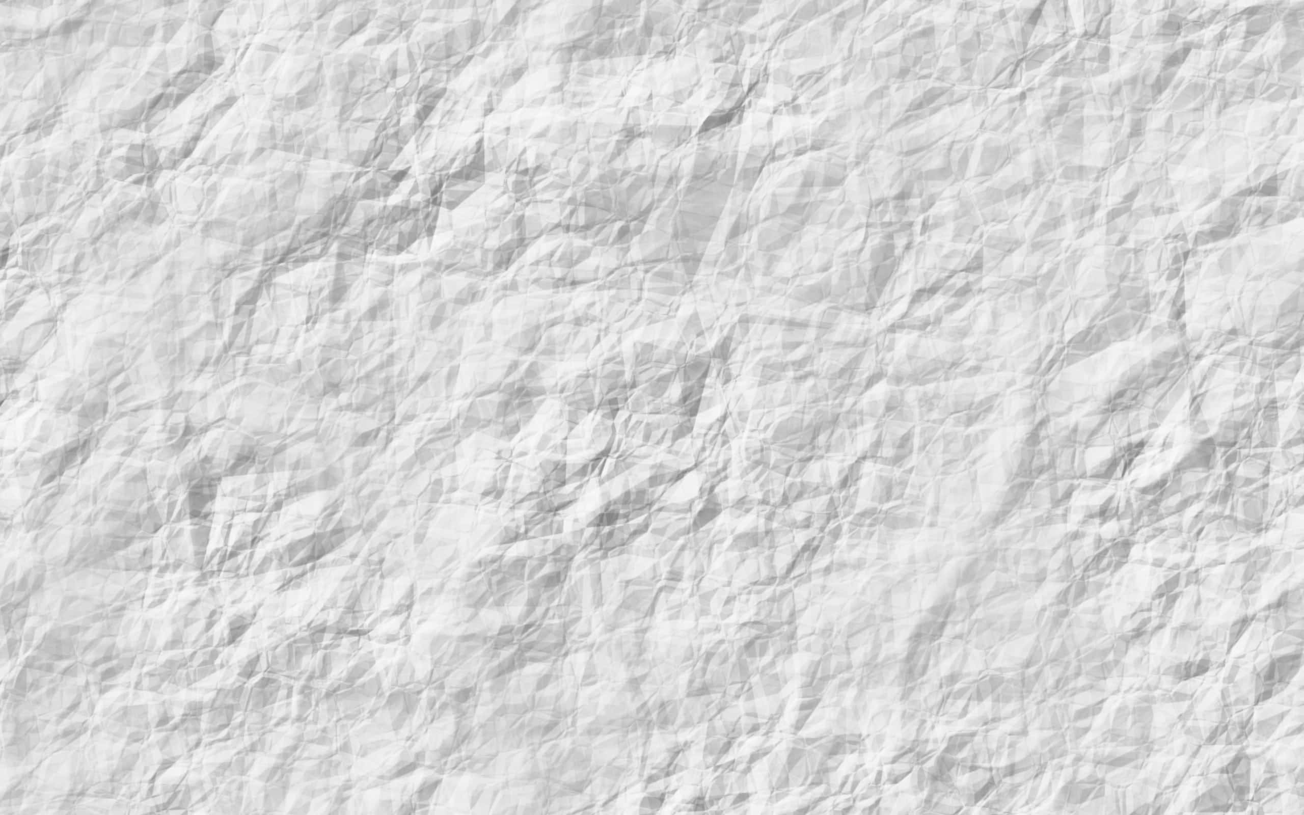 White HD 桌布 壁紙 — 一張嚴重皺摺的白紙特寫，深色陰影和柔和的高光營造出觸感紋理表面。