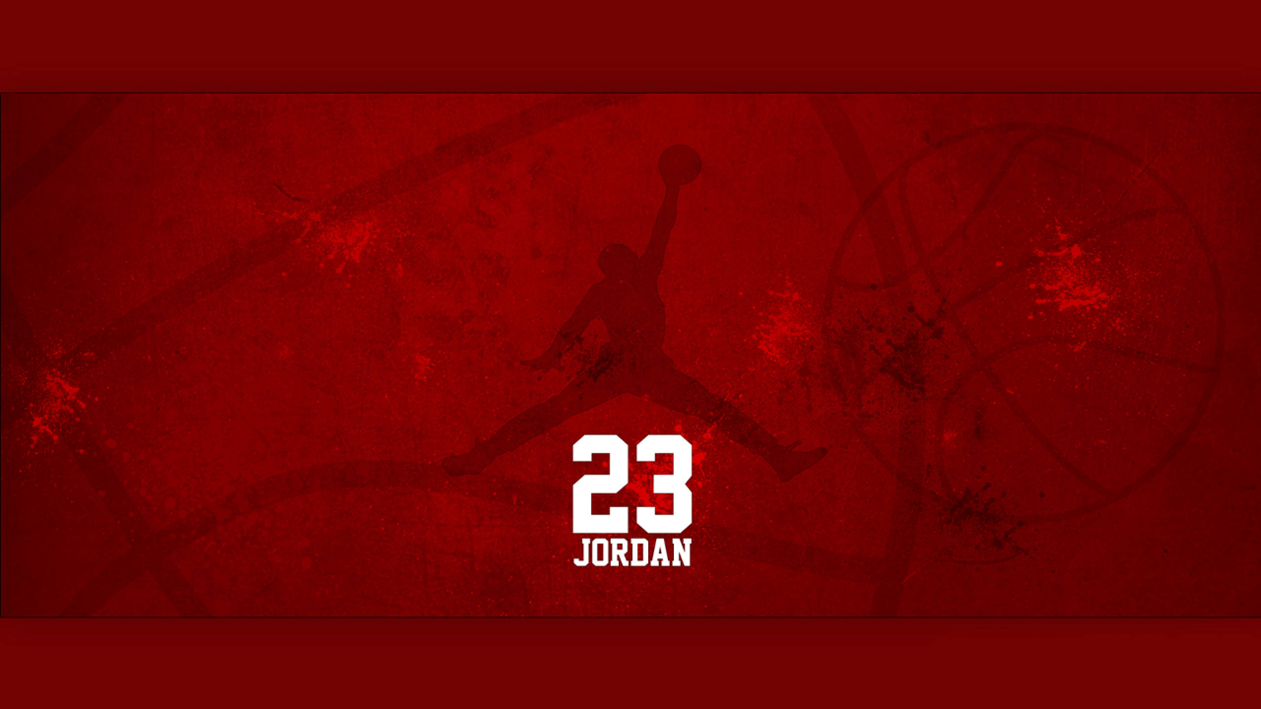 Air Jordan 桌布 壁紙 — 一張大膽的紅色紋理壁紙，上面有麥可喬丹在半空中灌籃的剪影，下方有23號和他的名字。