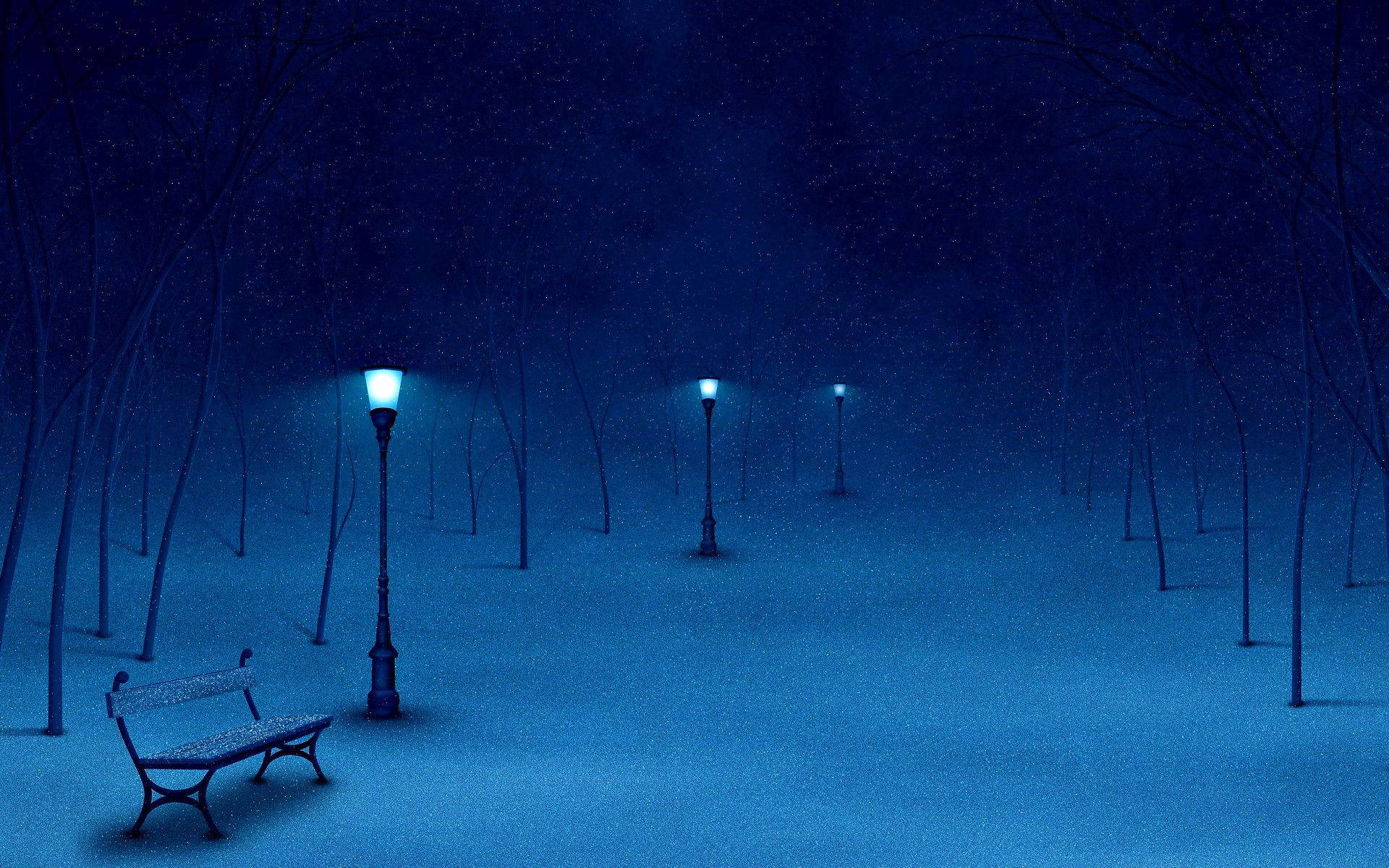 夜晚 桌布 壁紙 — 一張孤獨的長椅在夜晚的雪地公園中，坐在發光路燈下，周圍是光禿禿的樹木和飄落的雪。